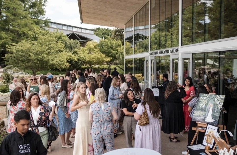 Conference photography of attendees networking in Dallas, TX.