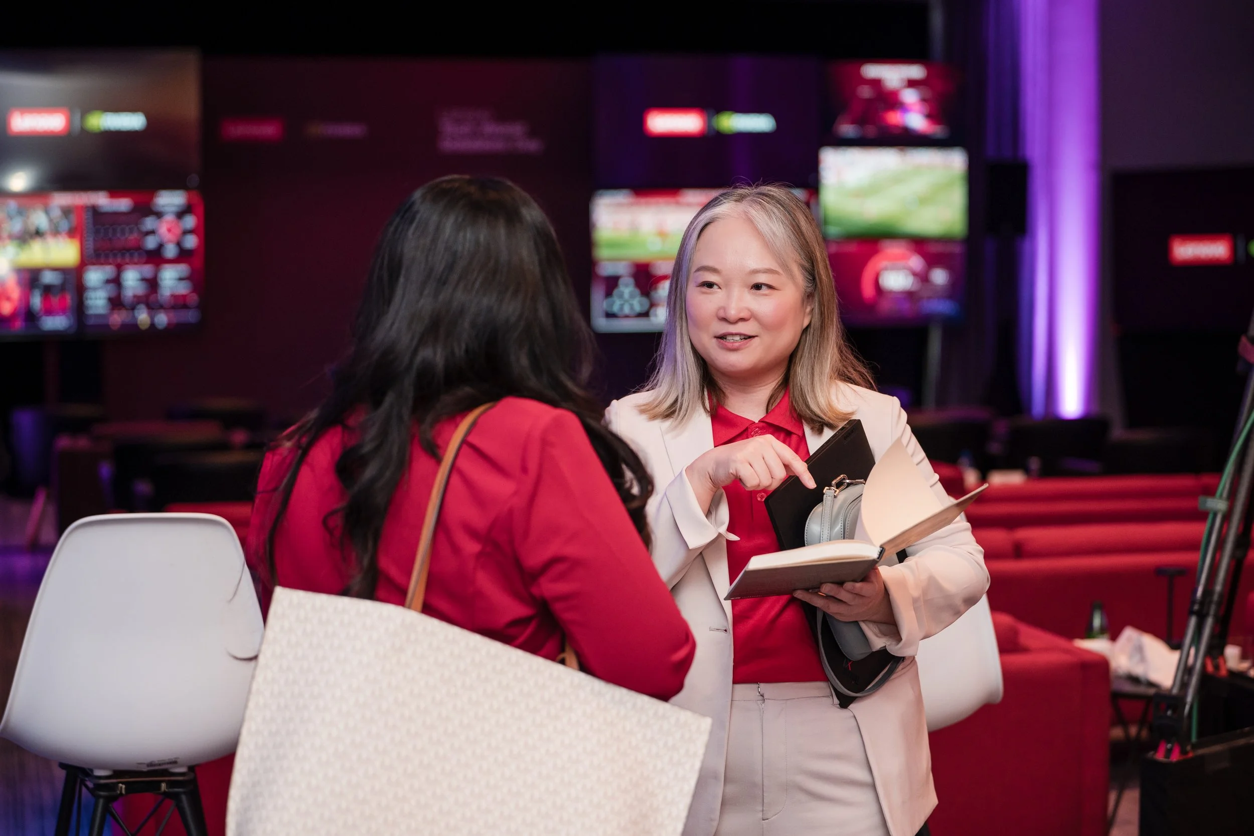 Executives photographed networking at a VIP hospitality event in Dallas.