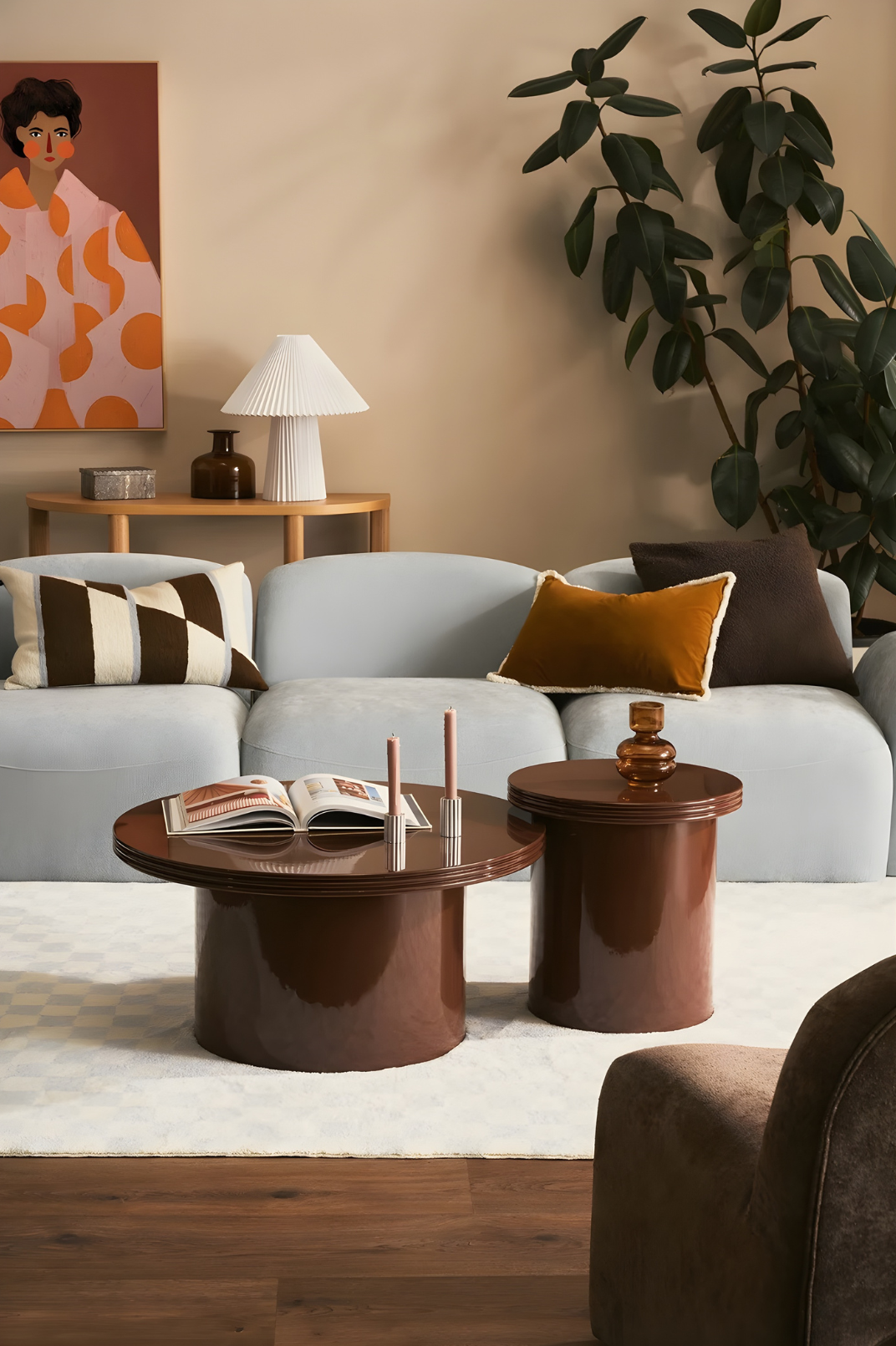 Styled living room with blue sofa, layered décor and warm contemporary details.