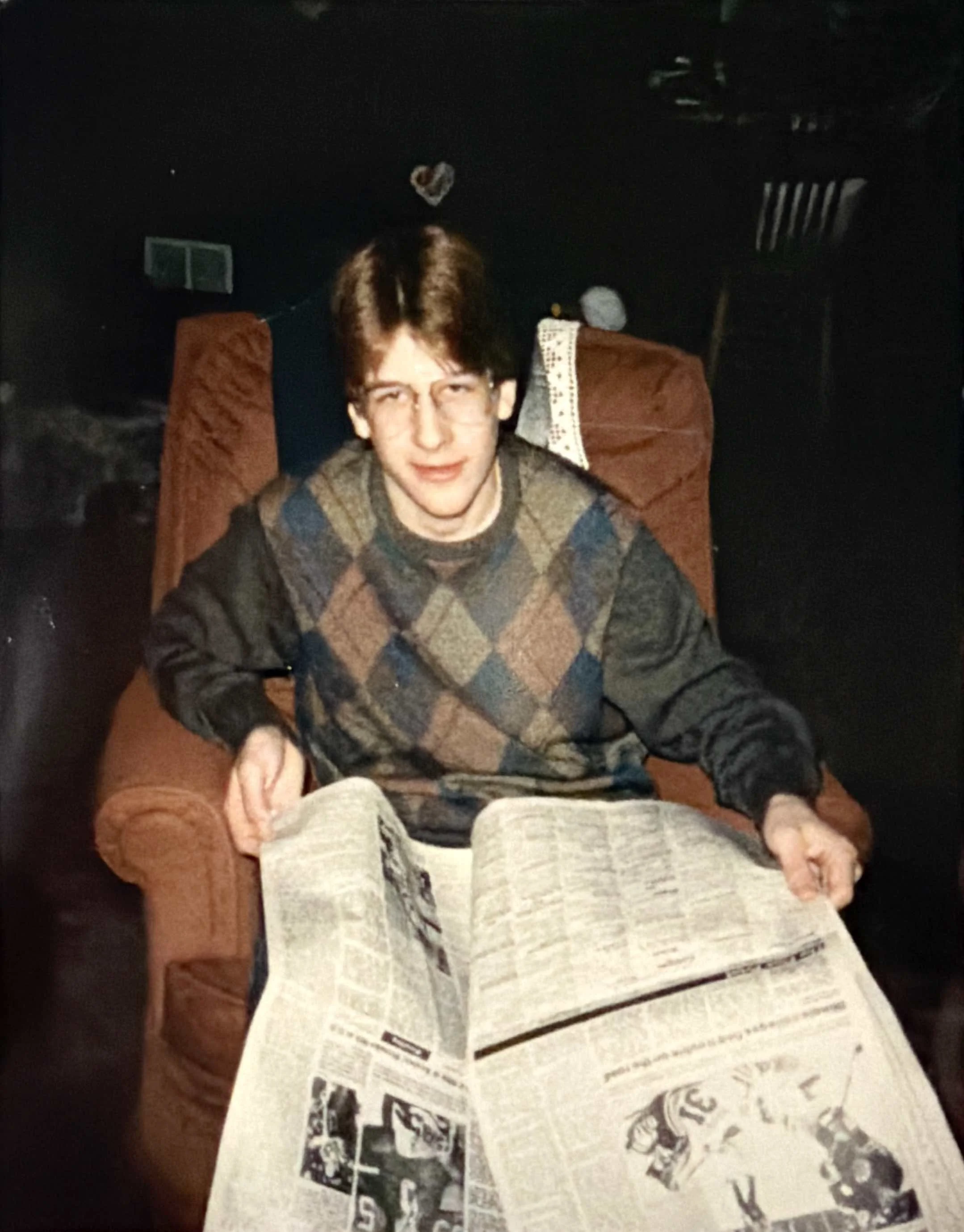 Alan Jerousek reading the sports page, 1985.jpg