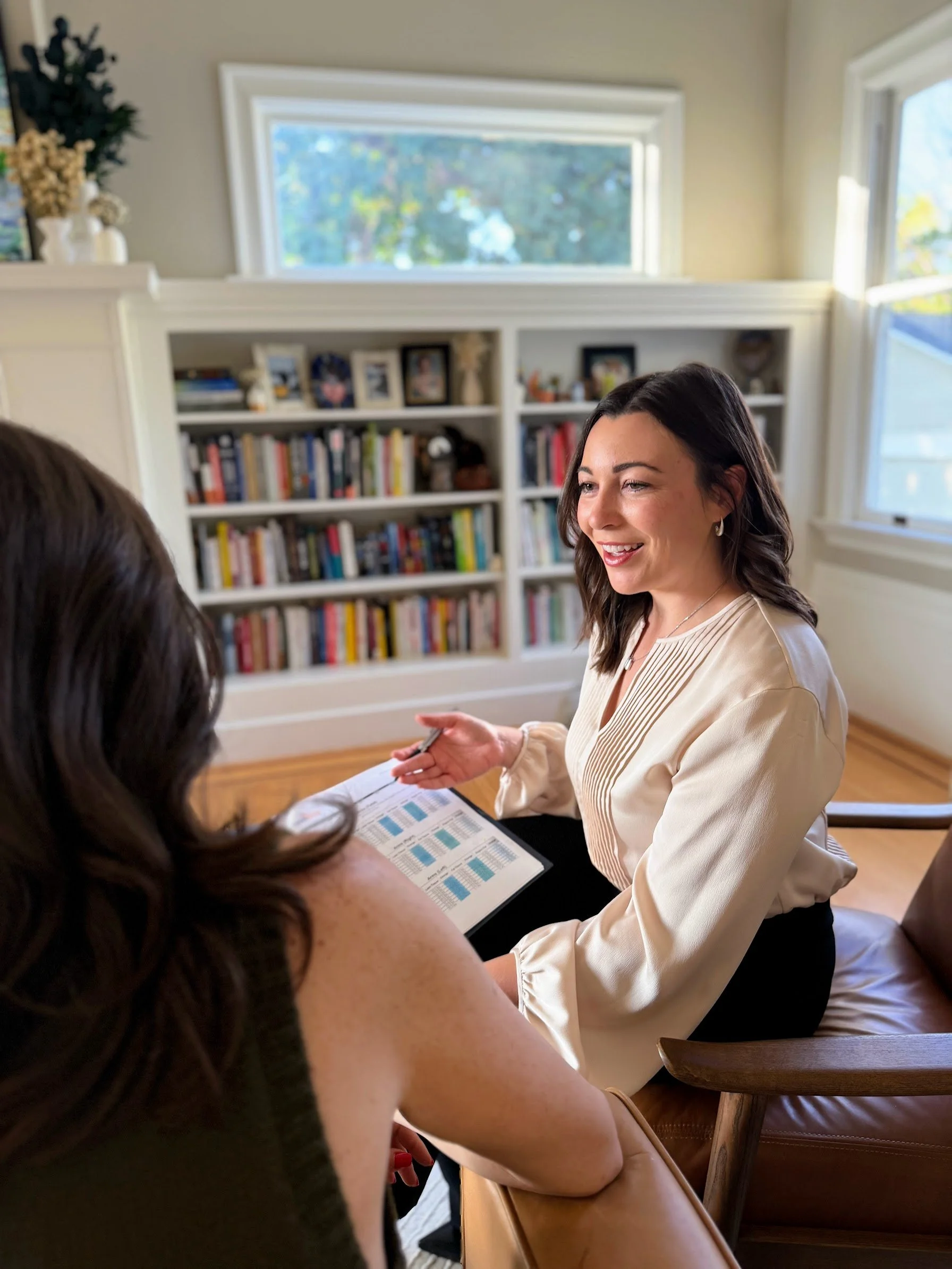 Dr. Ariana Feuvrier talking with a patient during an in-depth visit