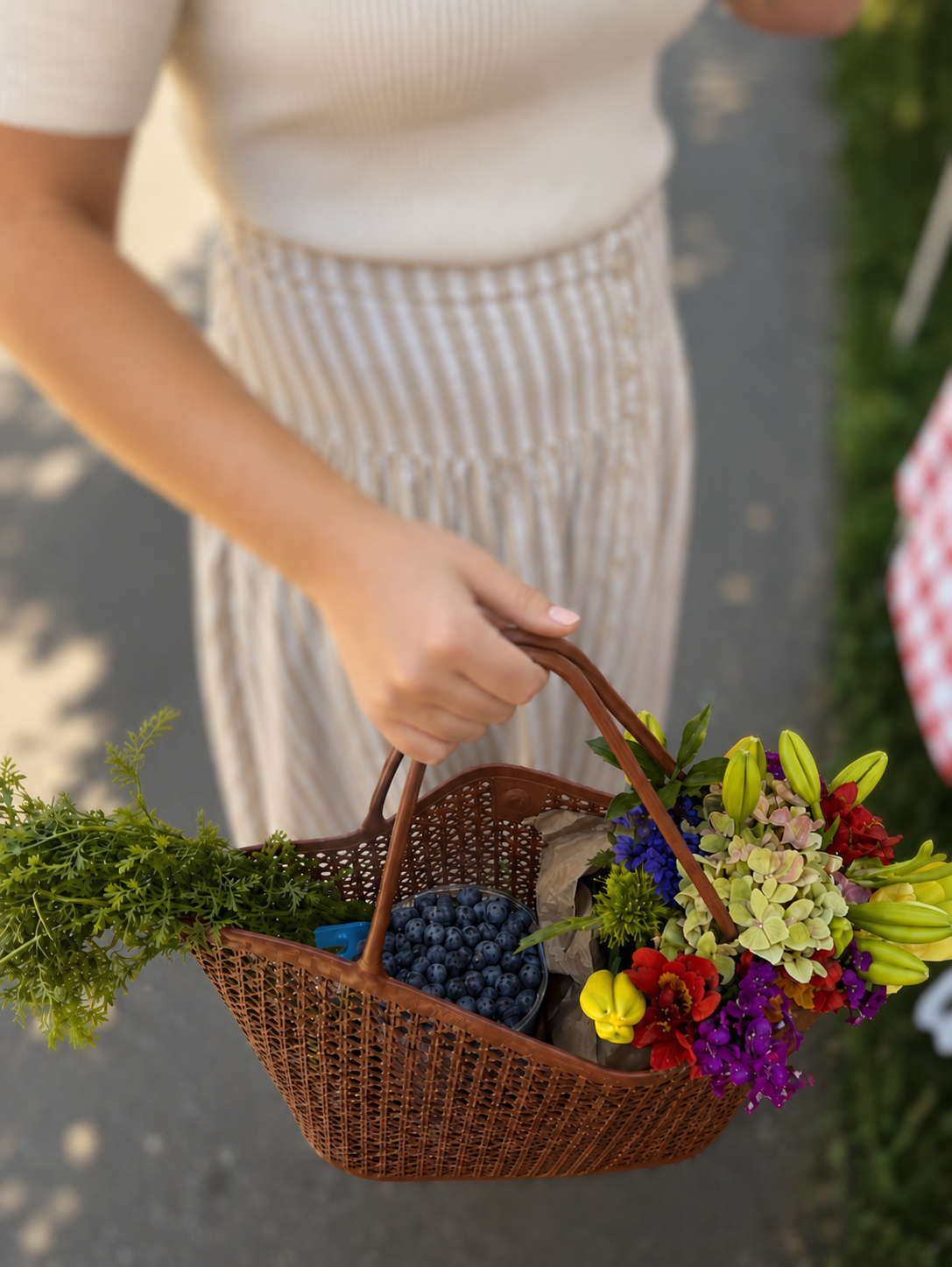 Basket of fresh produce and flowers from a farmers market