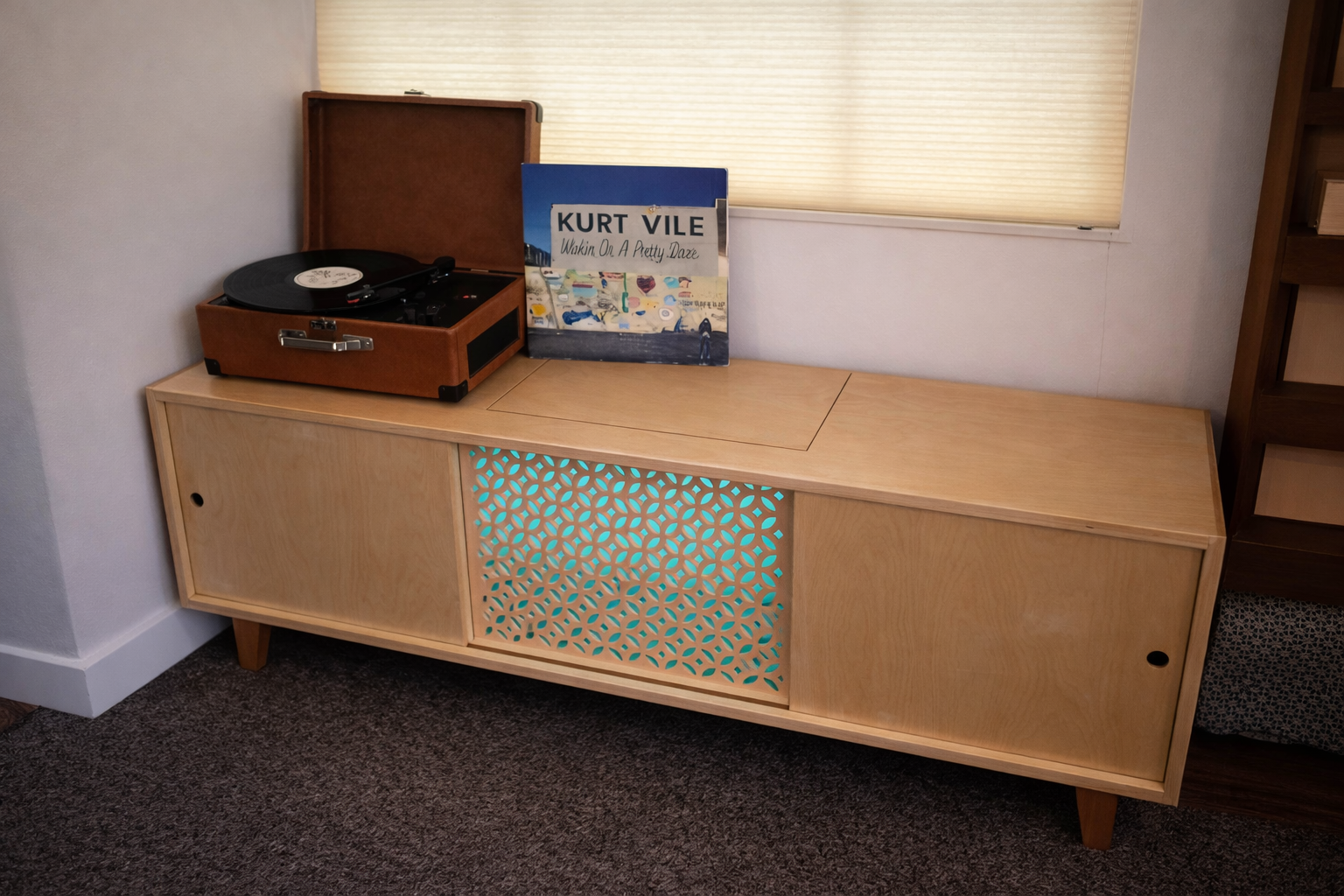 custom record cabinet with center screen and integrated lighting