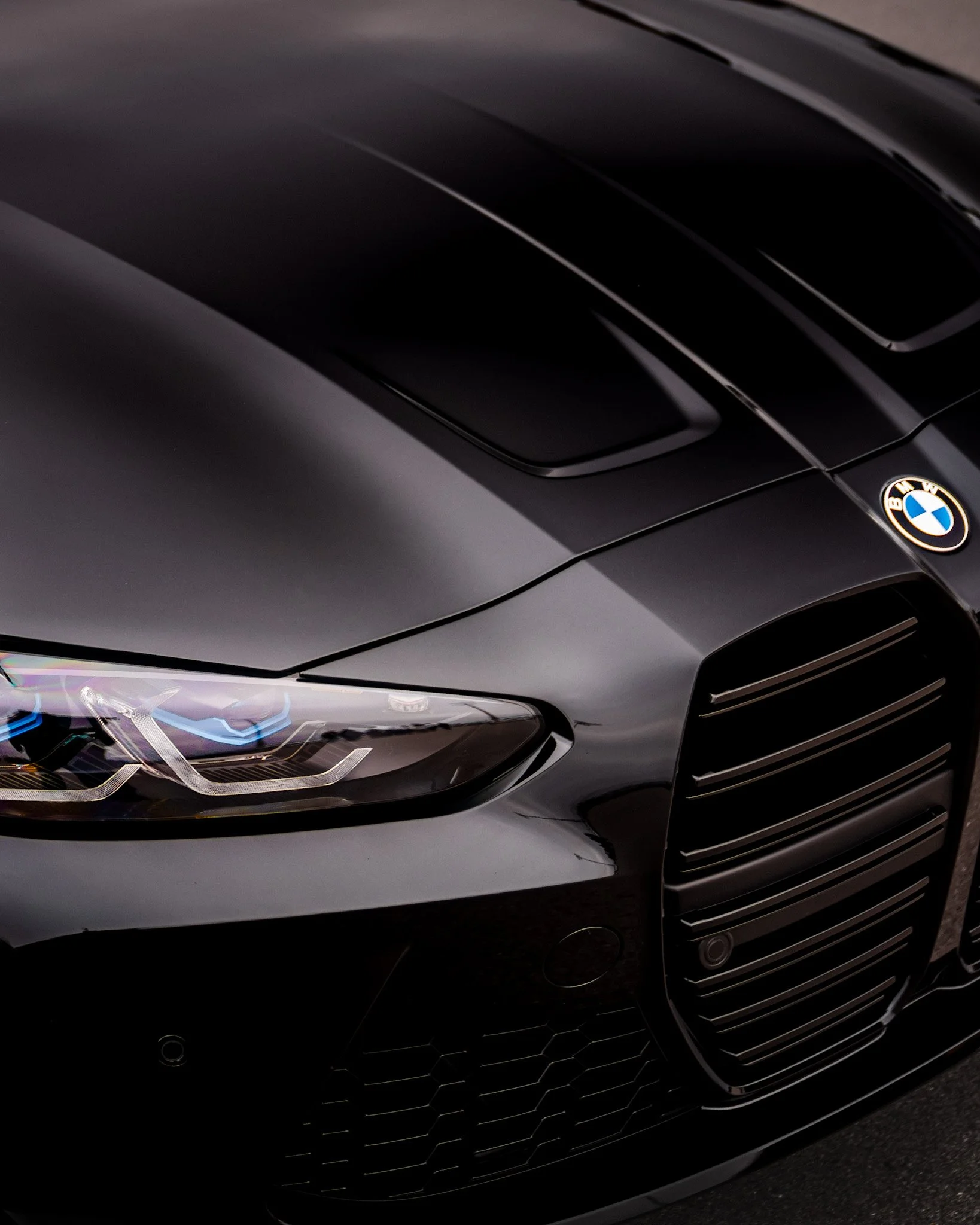 black m4 grill/badge/headlight shot