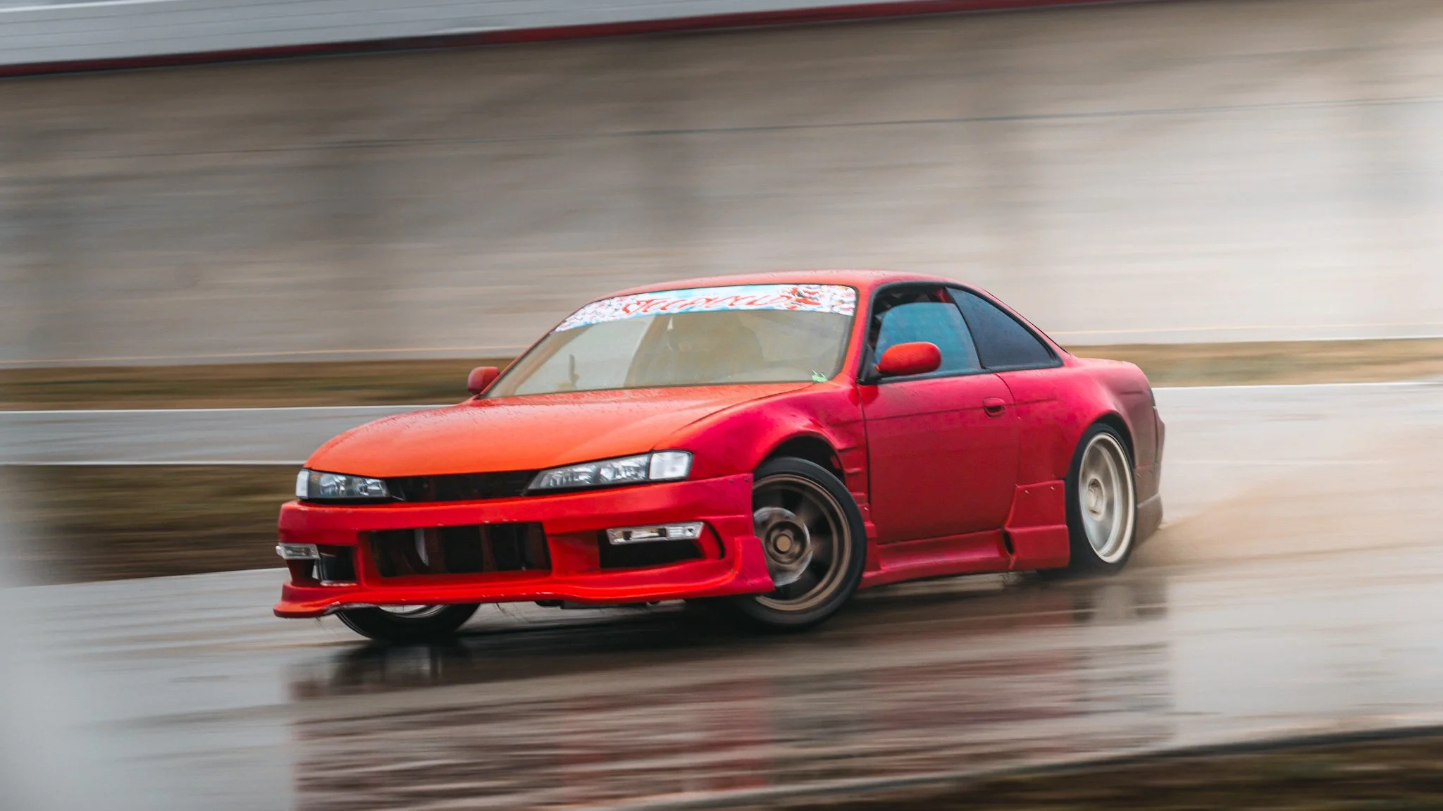 Red s14 240sx drifting at stoopicold at nashville super speedway