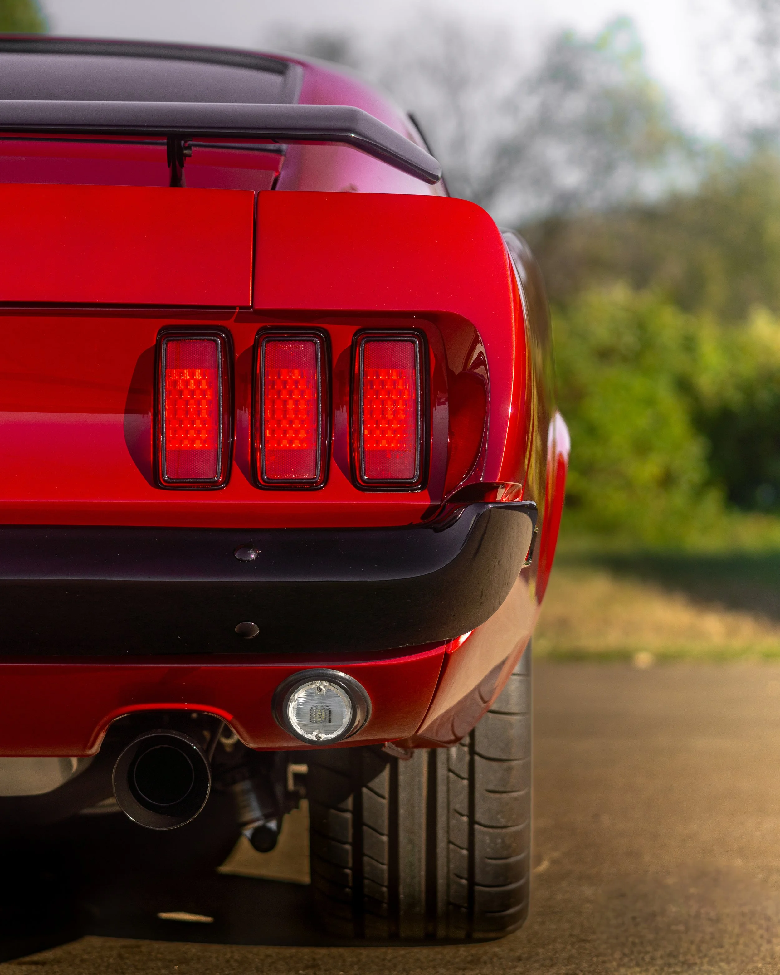 rear passenger side taillight shot of red 1969 coyote swap mustang