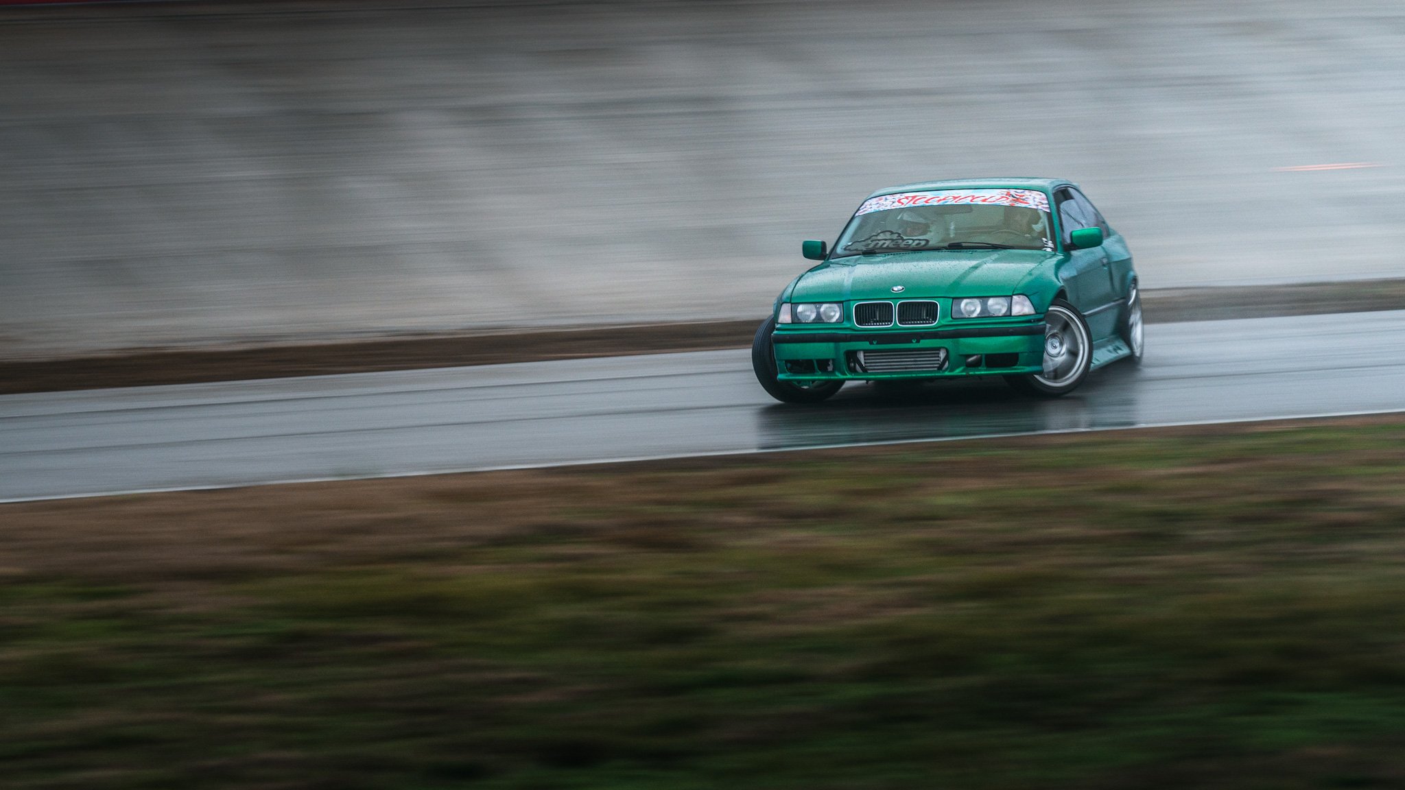 green bmw drifting at stoopicold at nashville super speedyway