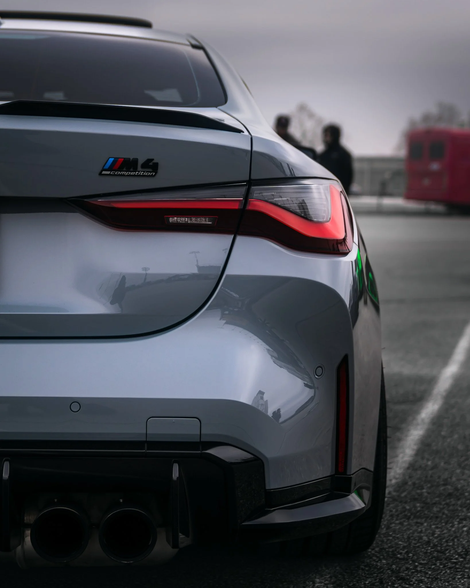 Rear shot of grey BMW M4 badge and tail light