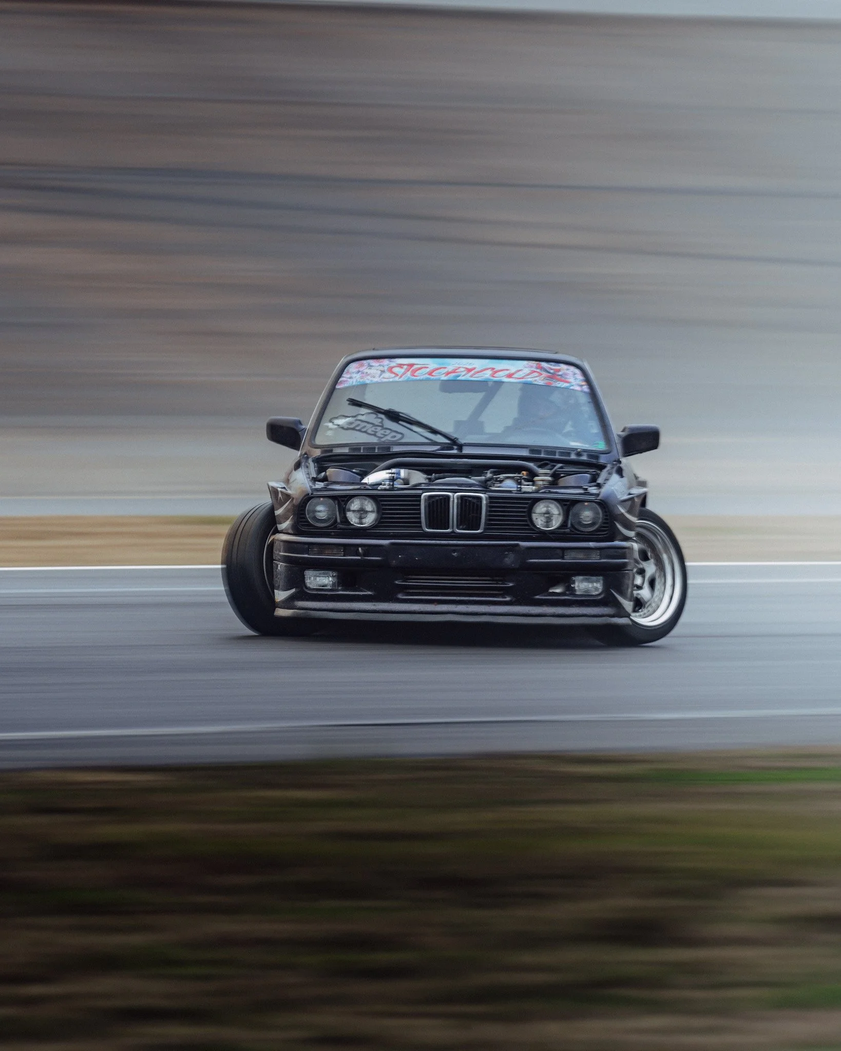dark purple bmw e30 drifting at stoopicold