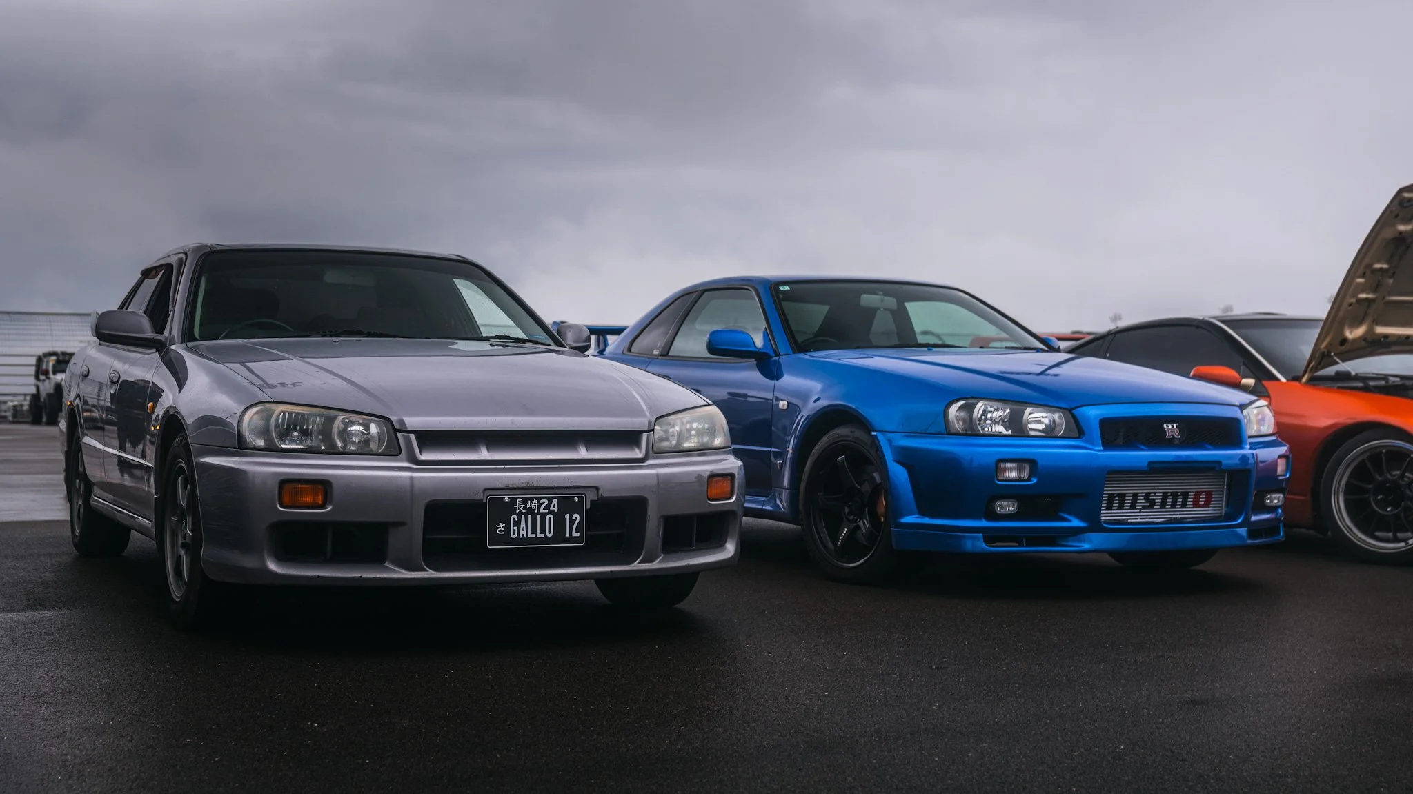 four door R34 and Nismo GT-R r34 at Nashville cars and coffee