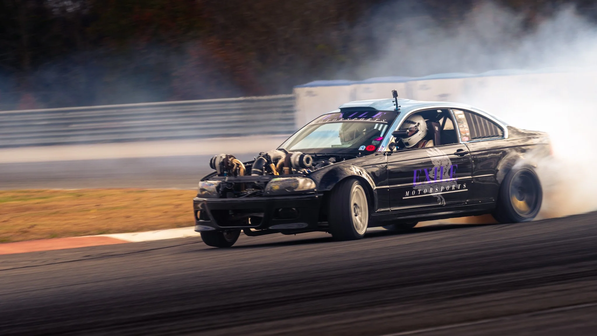 A high speed action shot with gt24drifting drifting at NCM Motorsports Park in Bowling Green Kentuckythrowing lots of smoke