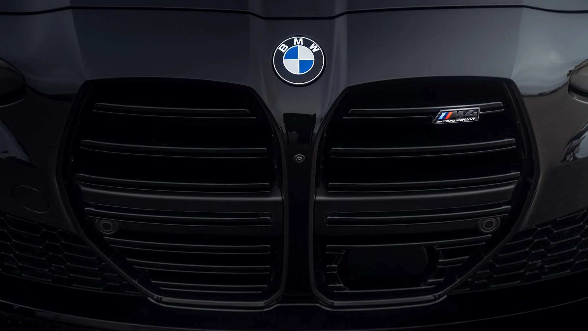 Black BMW m4 grille and badge shot