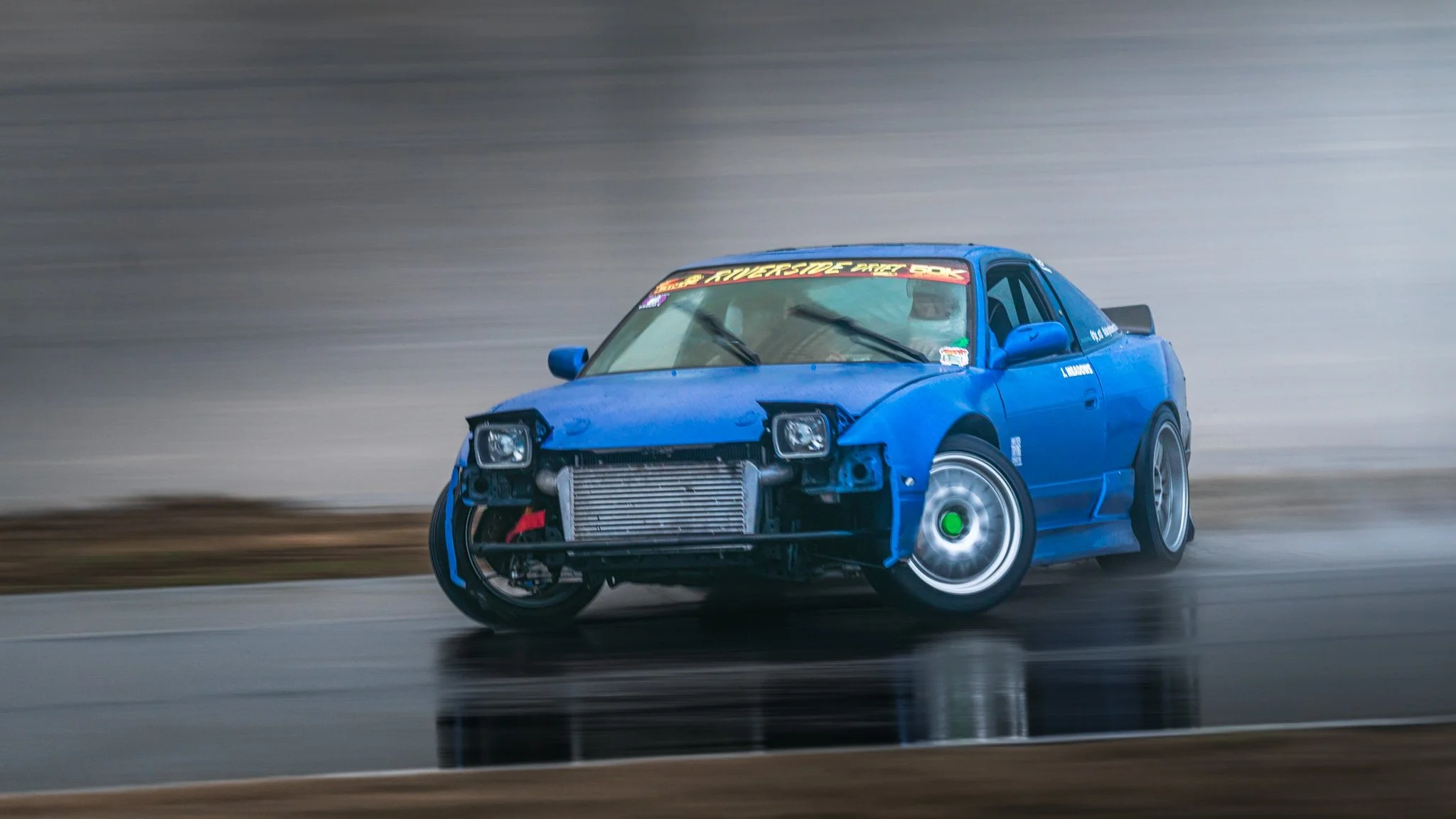 Blue 240sx S13 drifting  at stoopicold at Nashville Super Speedway