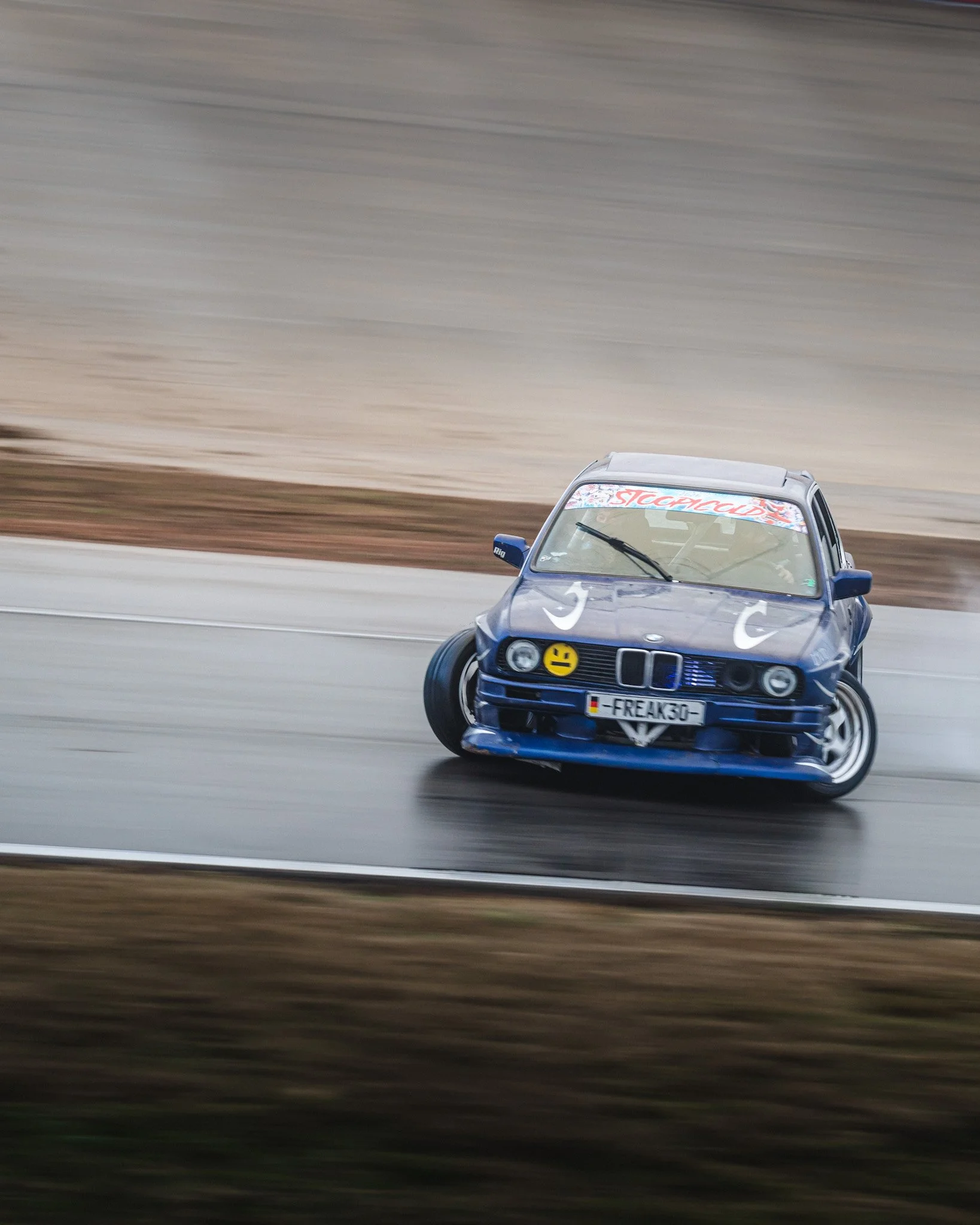Blue E30 drifting  at stoopicold at Nashville Super Speedway