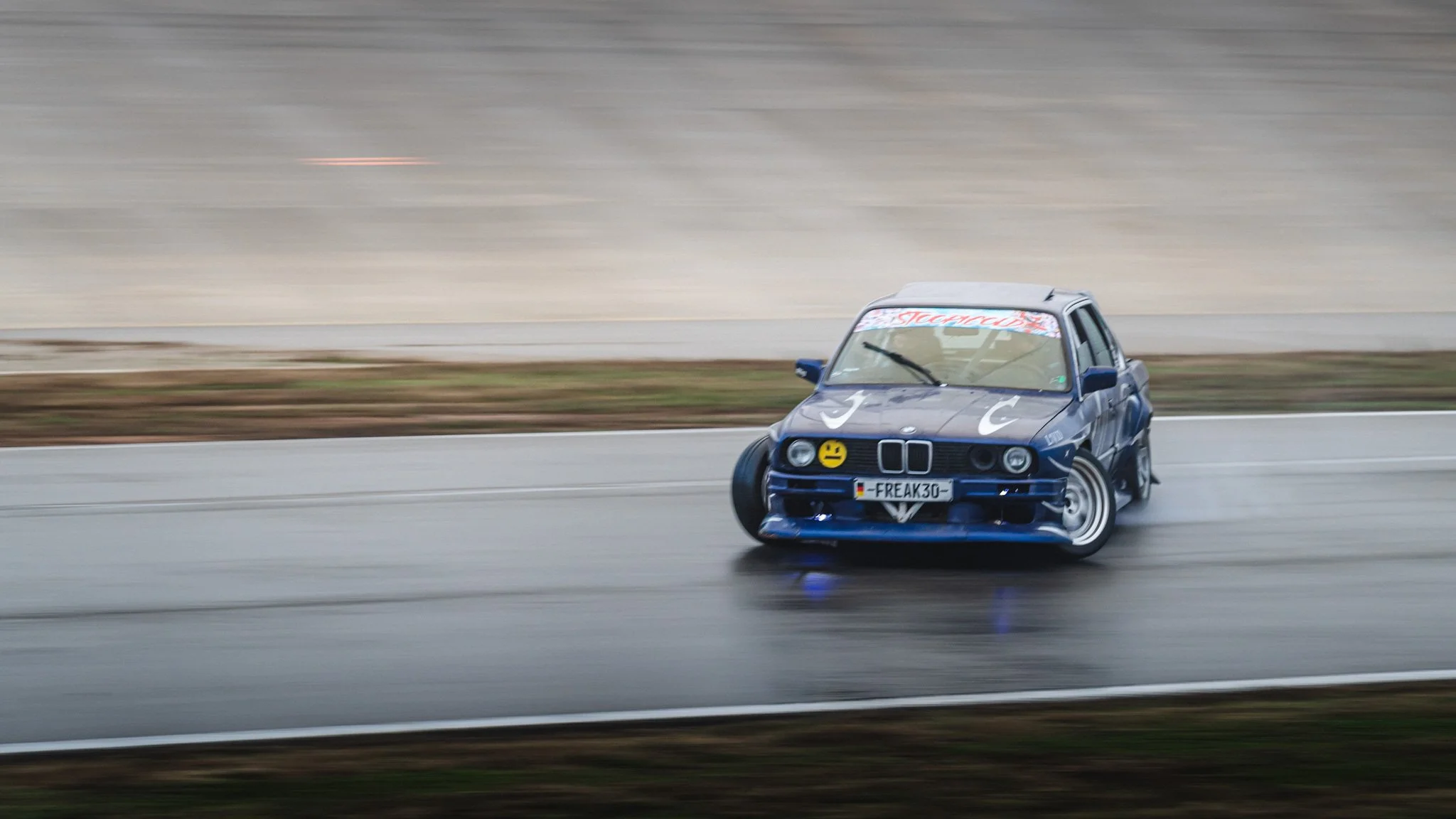 Blue E30 drifting  at stoopicold at Nashville Super Speedway