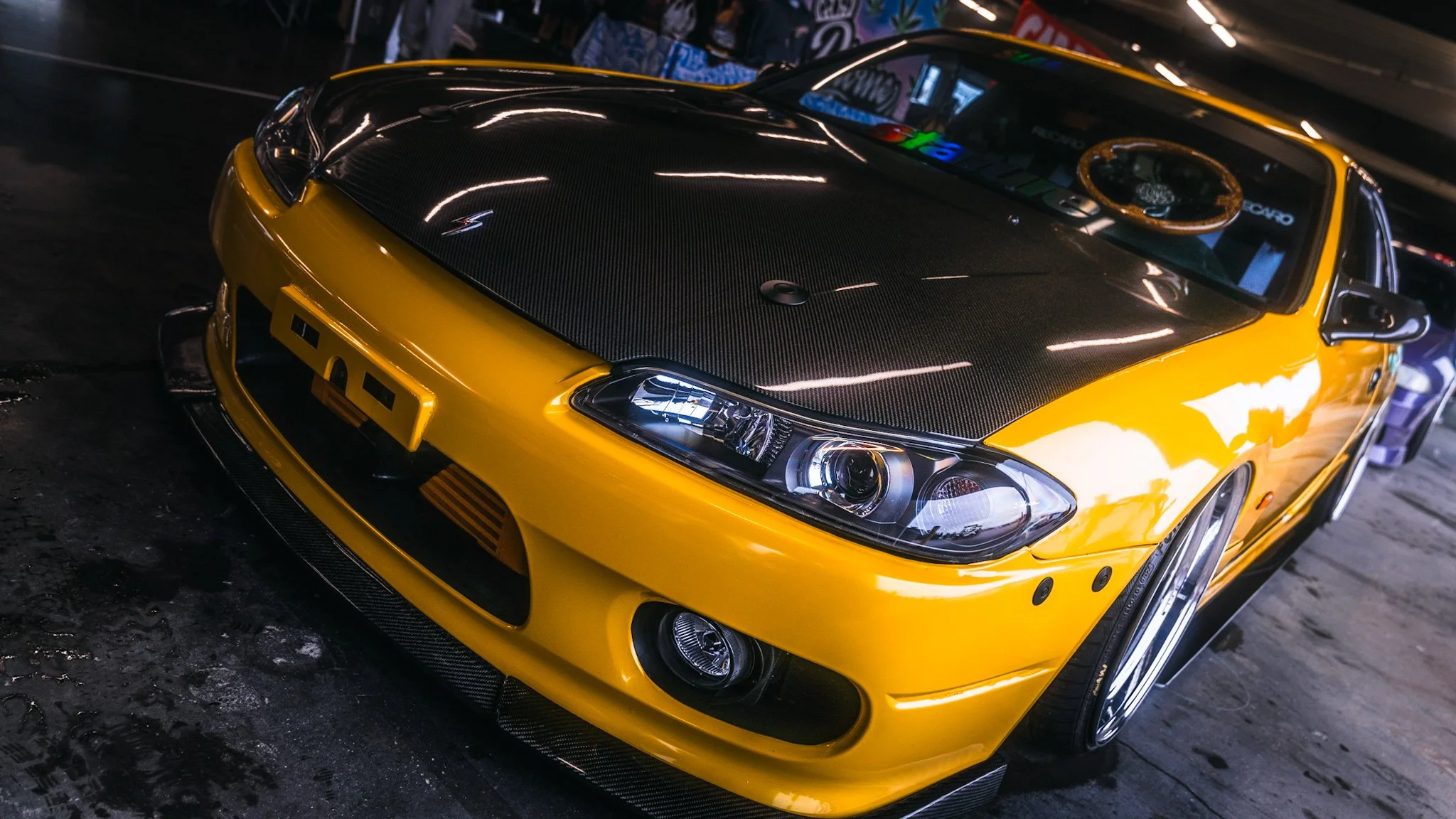 front angled shot of yellow Nissan S14.5 at stoopicold