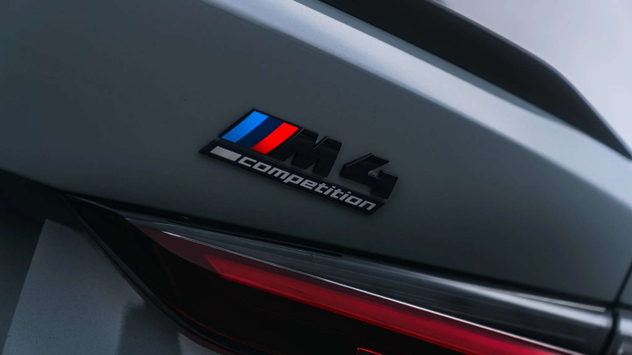 grey BMW M4 badge shot