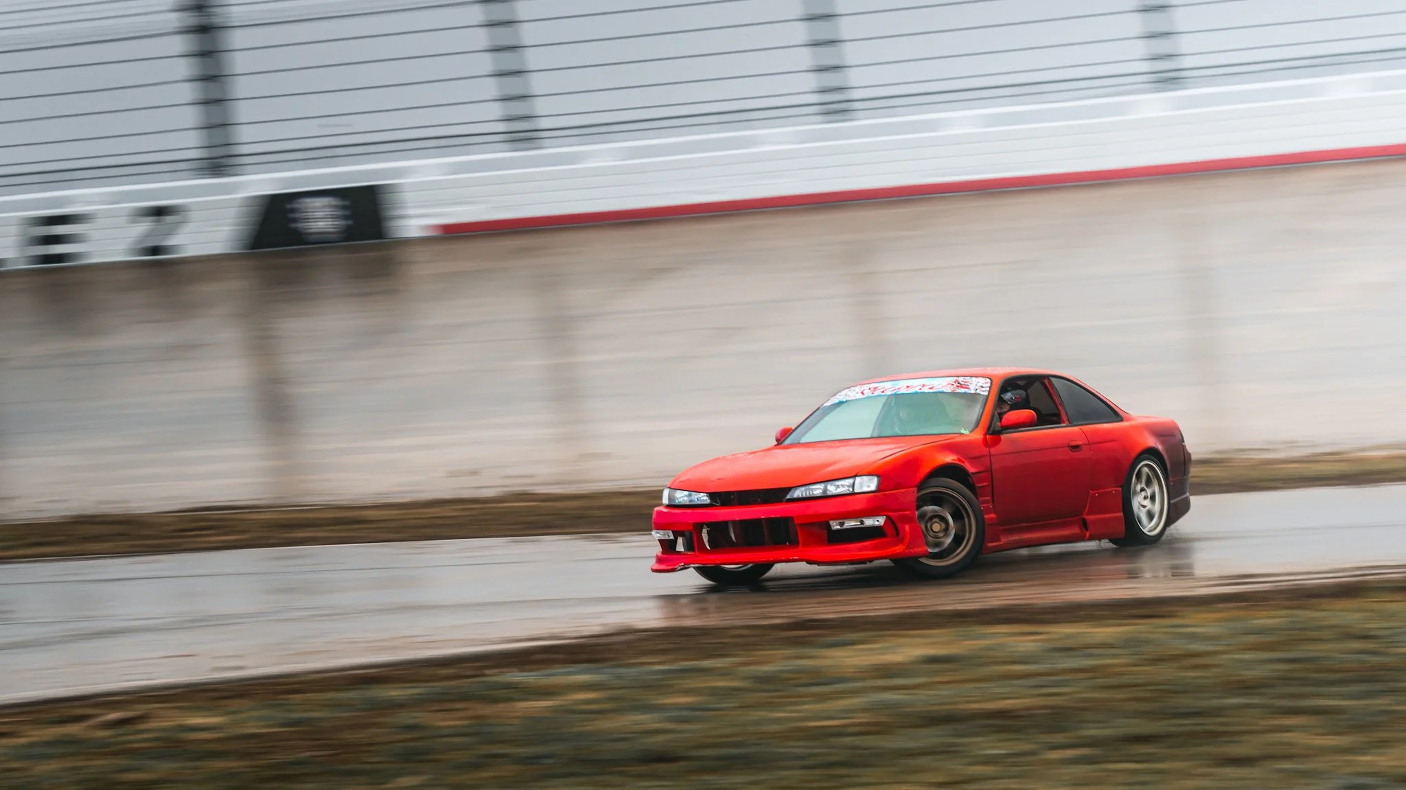 Red s14 240sx drifting at stoopicold at nashville super speedway