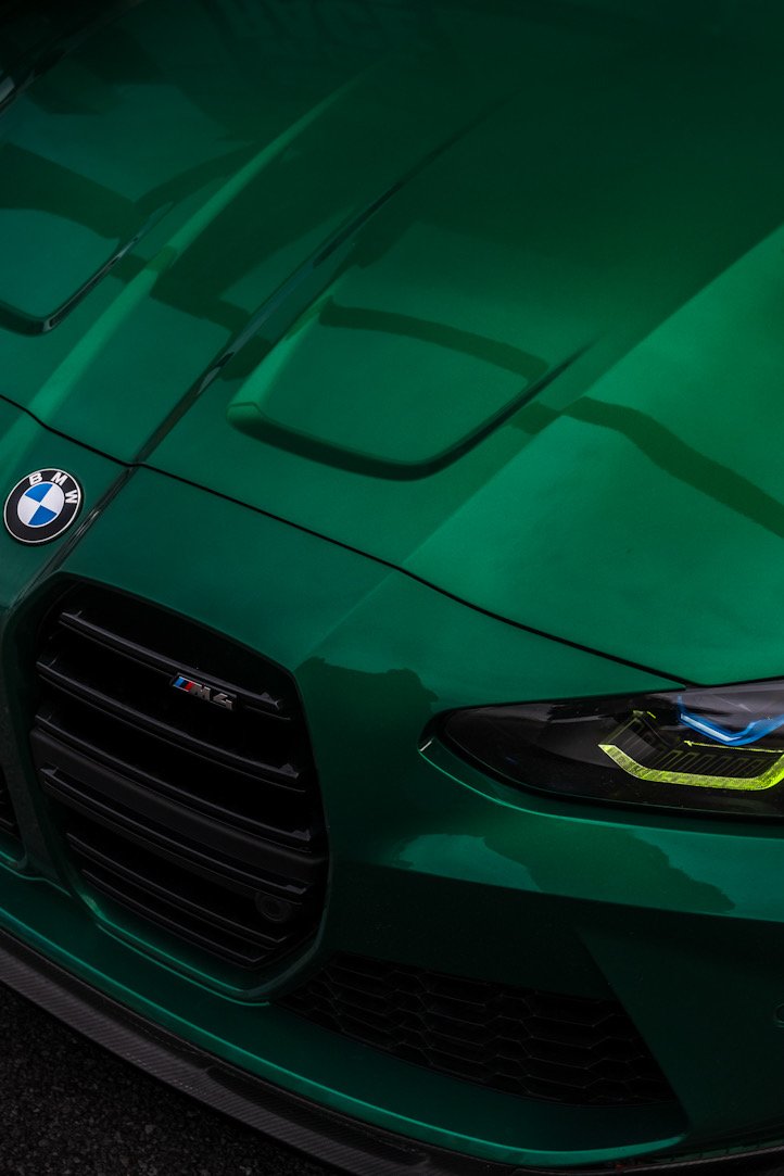 Isle of Man Green Metallic BMW M4 front right shot with badges
