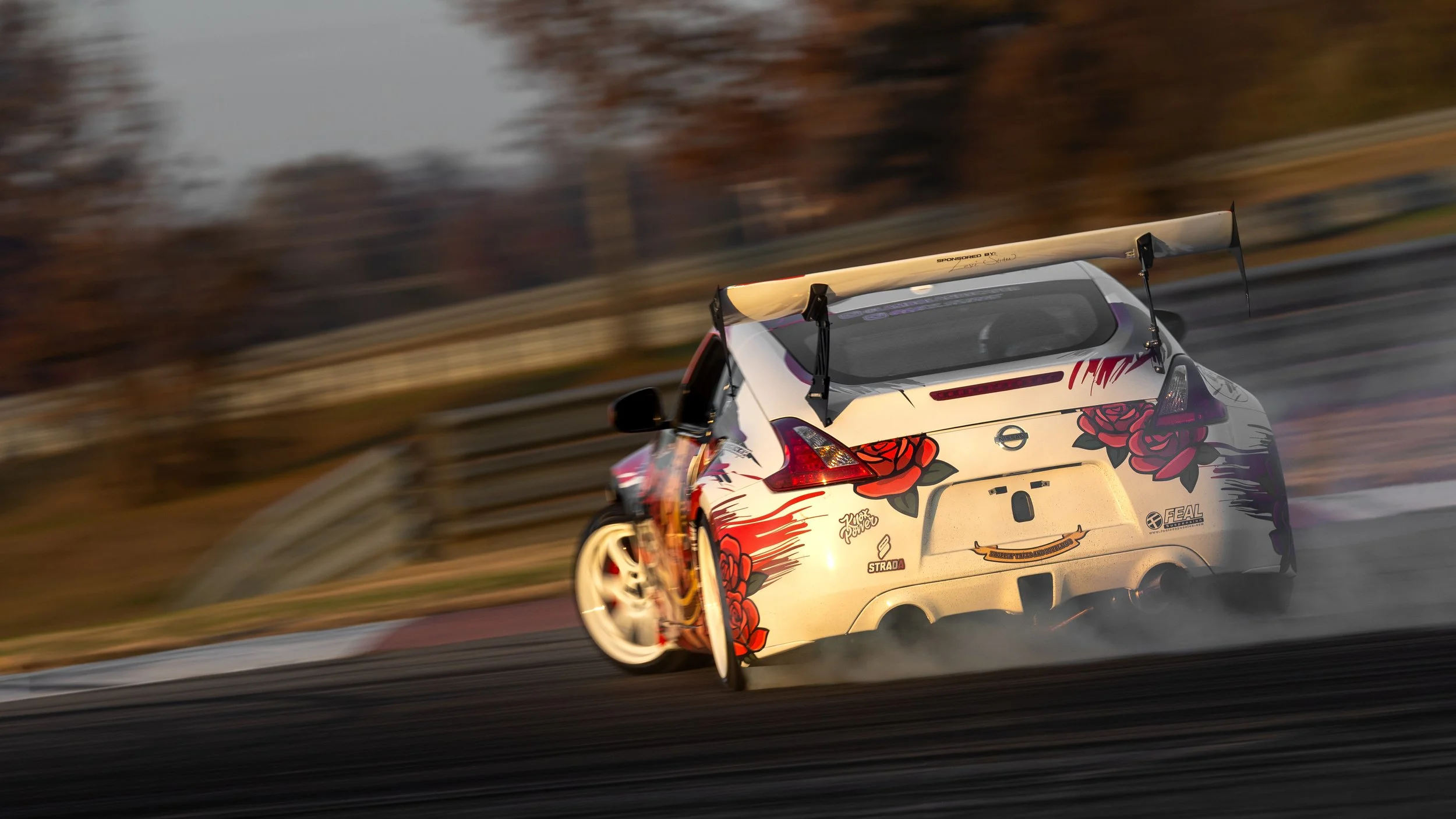back shot of lambo landscaper drifting at NCM Motorsports Park in Bowling Green Kentucky