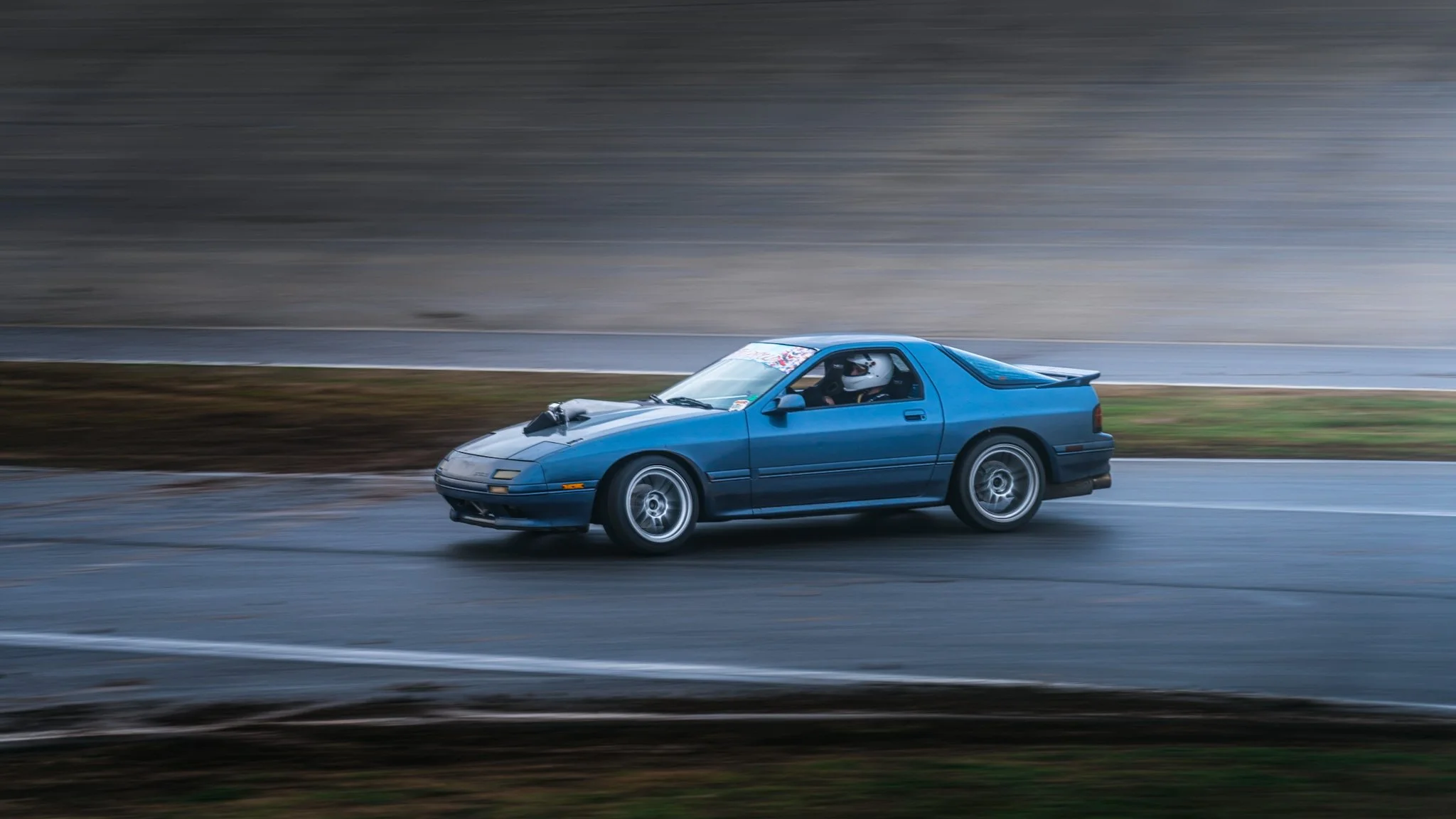 Blue Mazda FC RX-7 S13 drifting  at stoopicold at Nashville Super Speedway
