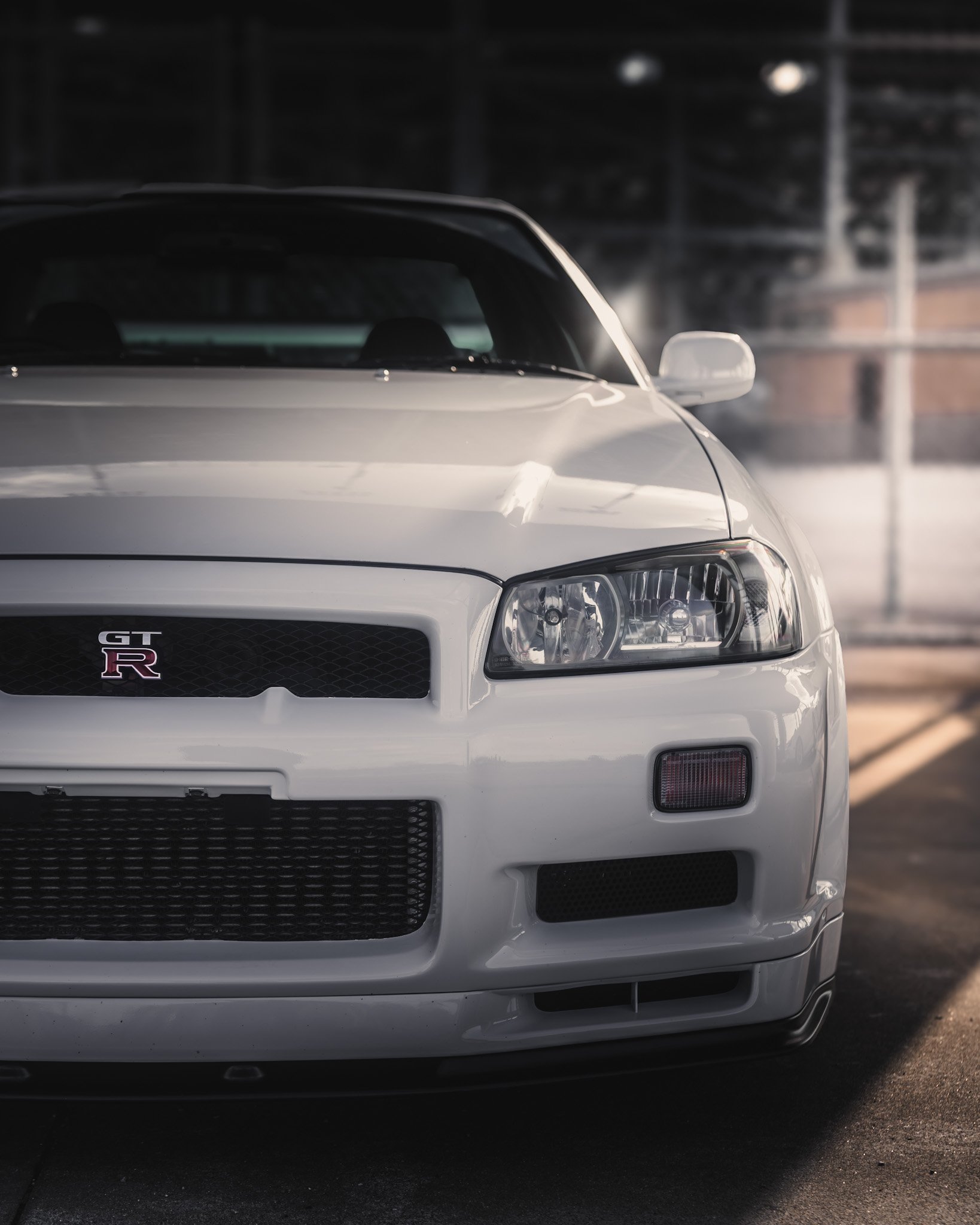 White Nissan GT-R sports car in an indoor parking lot