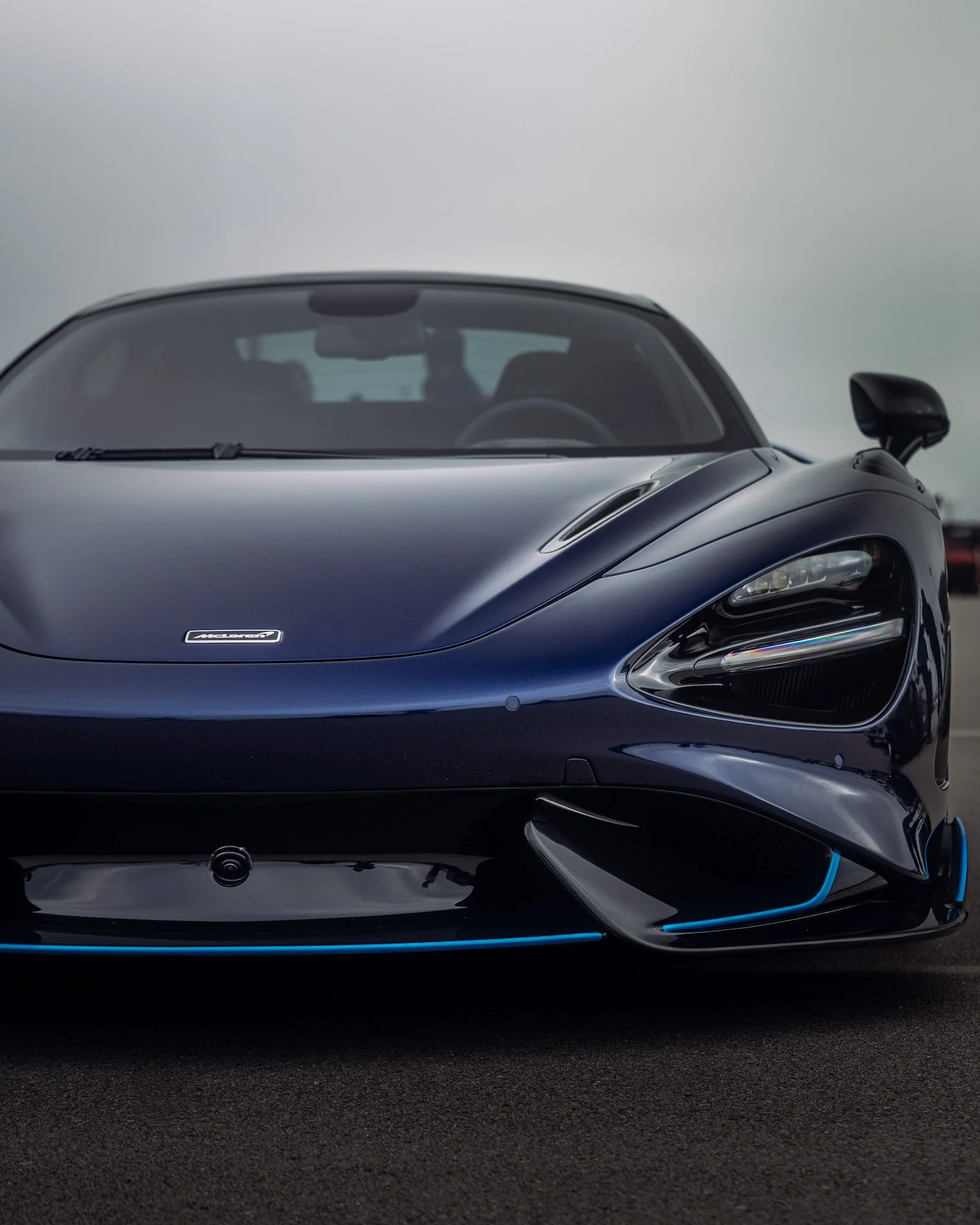 front right of a blue Mclaren