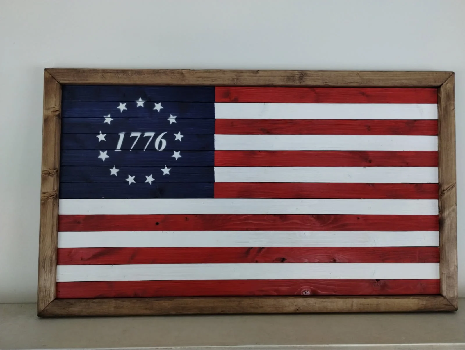 American Flag! This decorative American Flag is made to show your patriotism and be displayed on a will or on a mantle.