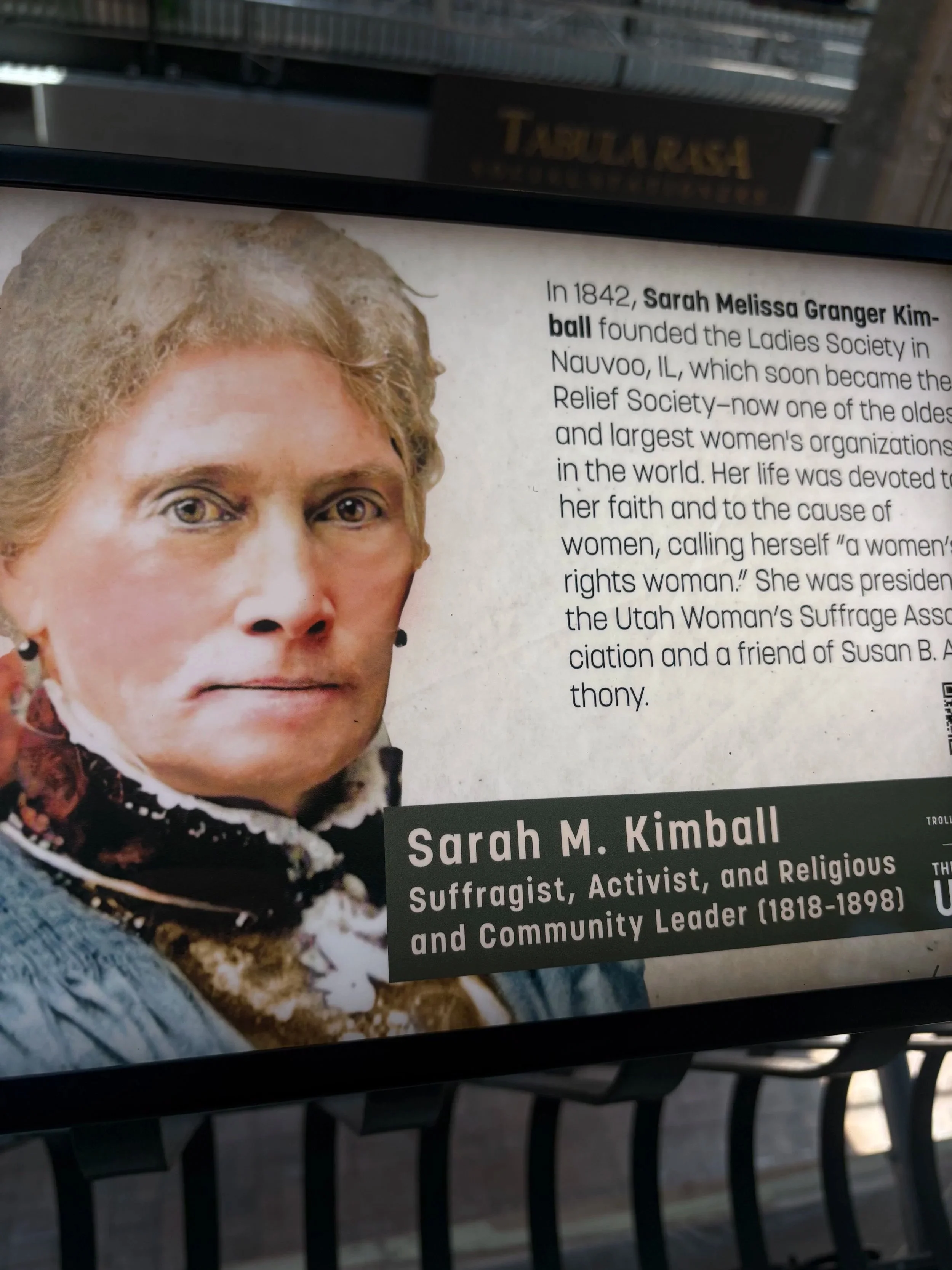 A close-up of a poster featuring Sarah Melissa Granger Kimball, an American suffragist, activist, and religious community leader from the 19th century. The poster includes her portrait and biographical details.