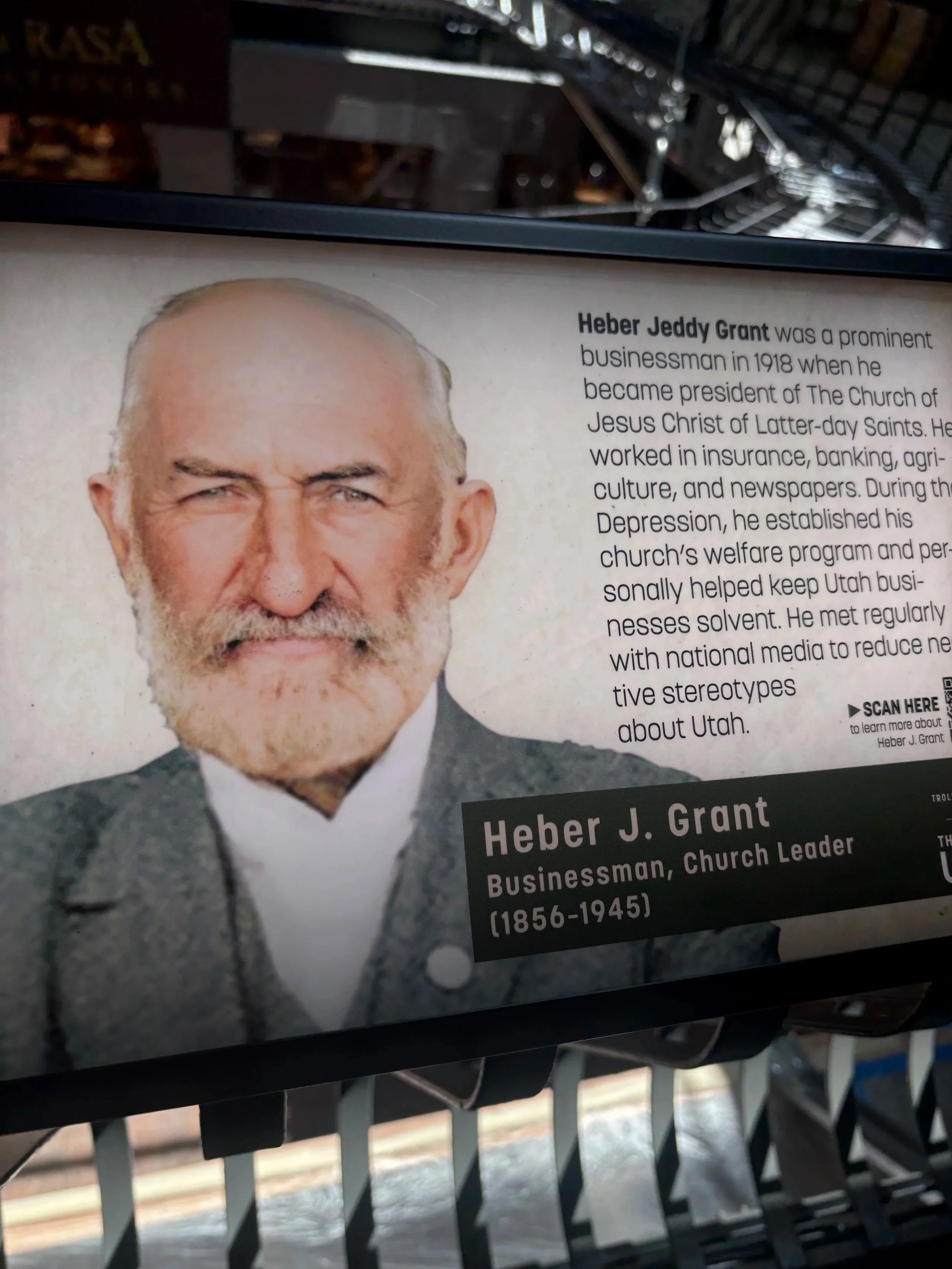 A historical poster featuring a photograph of Heber Jeddy Grant, with text about his life and leadership in The Church of Jesus Christ of Latter-day Saints.