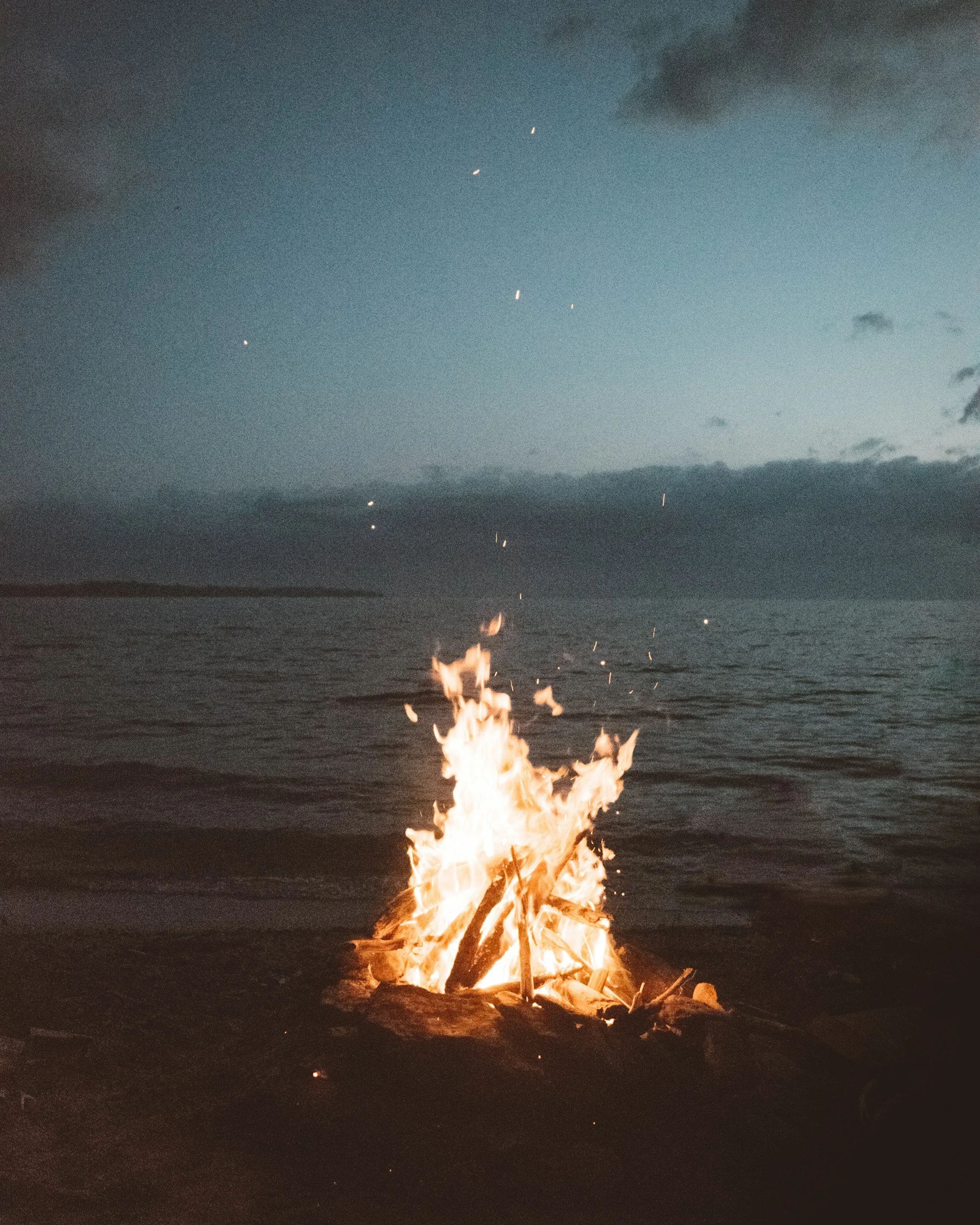 a bonfire on a Bay Area beach, representing in-person therapy for teens and adolescents; counseling in San Francisco and Marin. Helping youth and parents navigate anxiety, stress, identity, trauma, and life transitions with a depth-oriented approach.