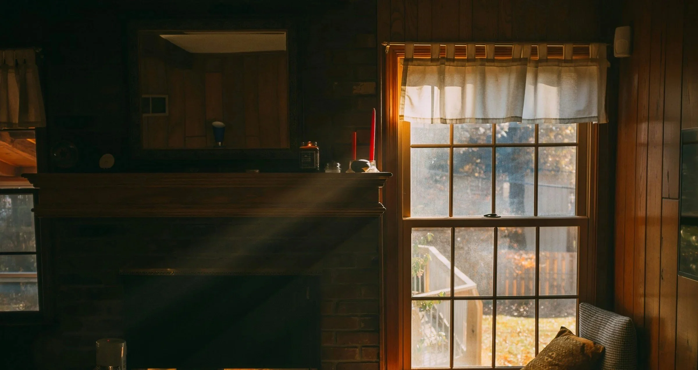 a sunlit window next to a fireplace, representing adult therapy in San Francisco and Marin, Bay Area, in-person counseling with a depth-oriented, psychodynamic, trauma-informed approach treating anxiety, depression, burnout, and life transitions.