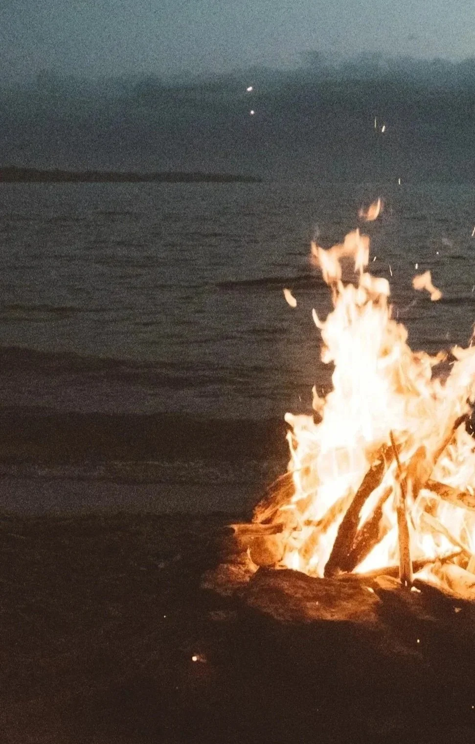 a bonfire on a Bay Area beach, representing in-person therapy for teens and adolescents; counseling in San Francisco and Marin. Helping youth and parents navigate anxiety, stress, identity, trauma, and life transitions with a depth-oriented approach.