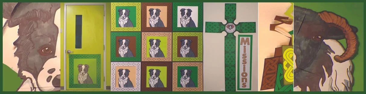 Decorated wall with board games, artwork of a dog, and a painting of a goat.