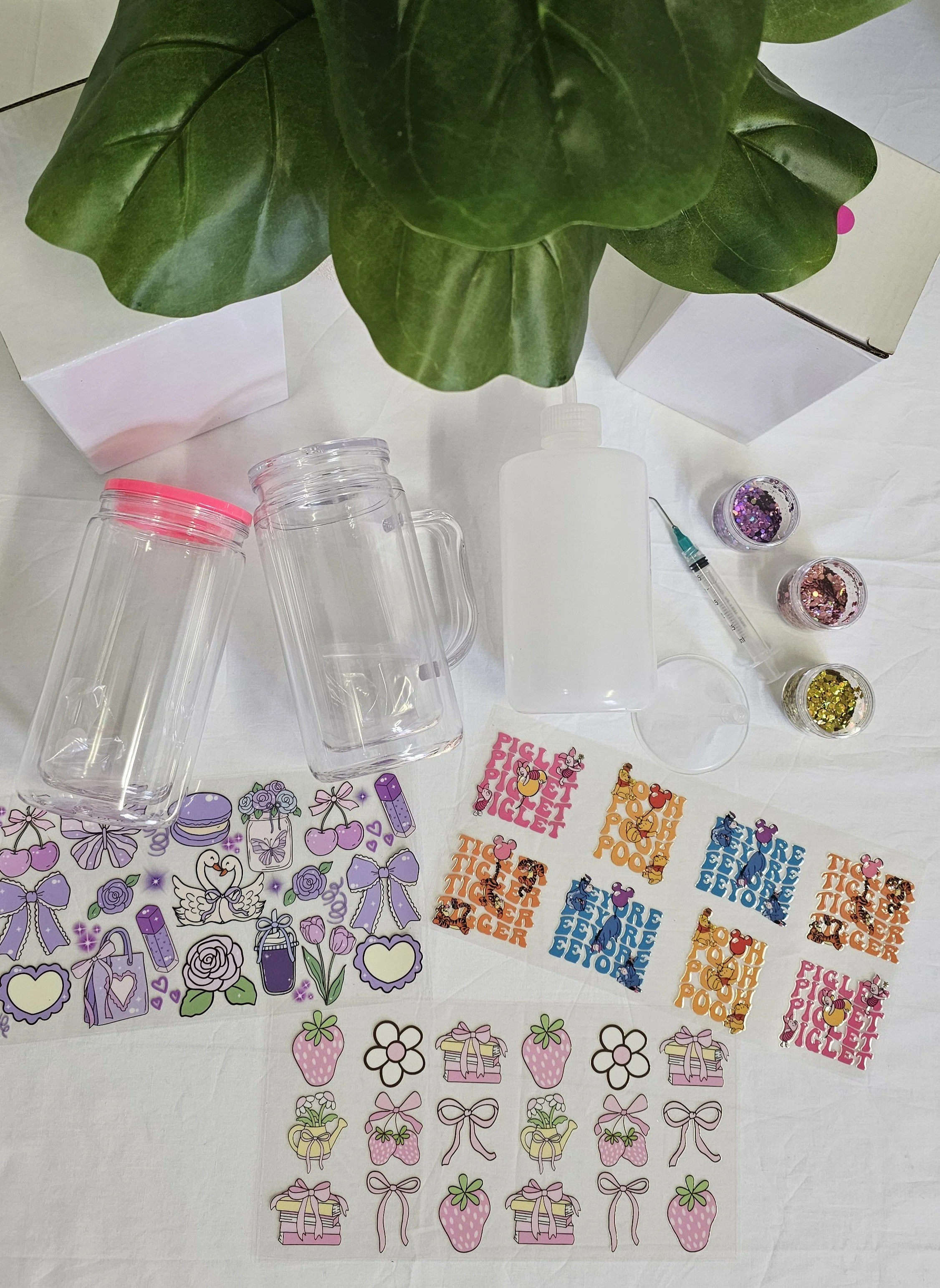 Snowglobe tumbler starter kit featuring blank tumblers, UV DTF wraps, glitter mixes, filling bottle, syringe and crafting accessories for beginner snowglobe tumbler makers (2).jpg