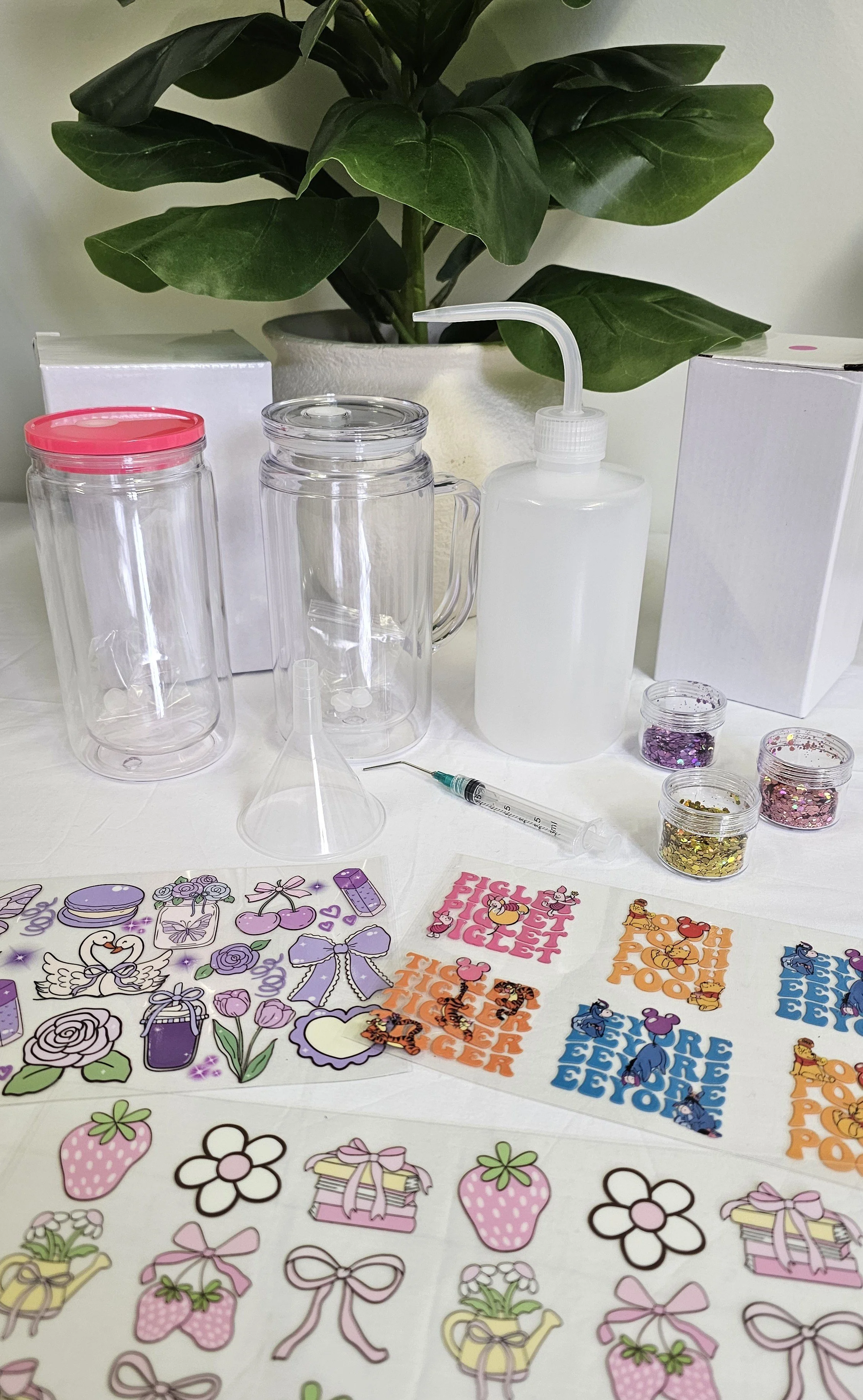 Snowglobe tumbler starter kit featuring blank tumblers, UV DTF wraps, glitter mixes, filling bottle, syringe and crafting accessories for beginner snowglobe tumbler makers (1).jpg