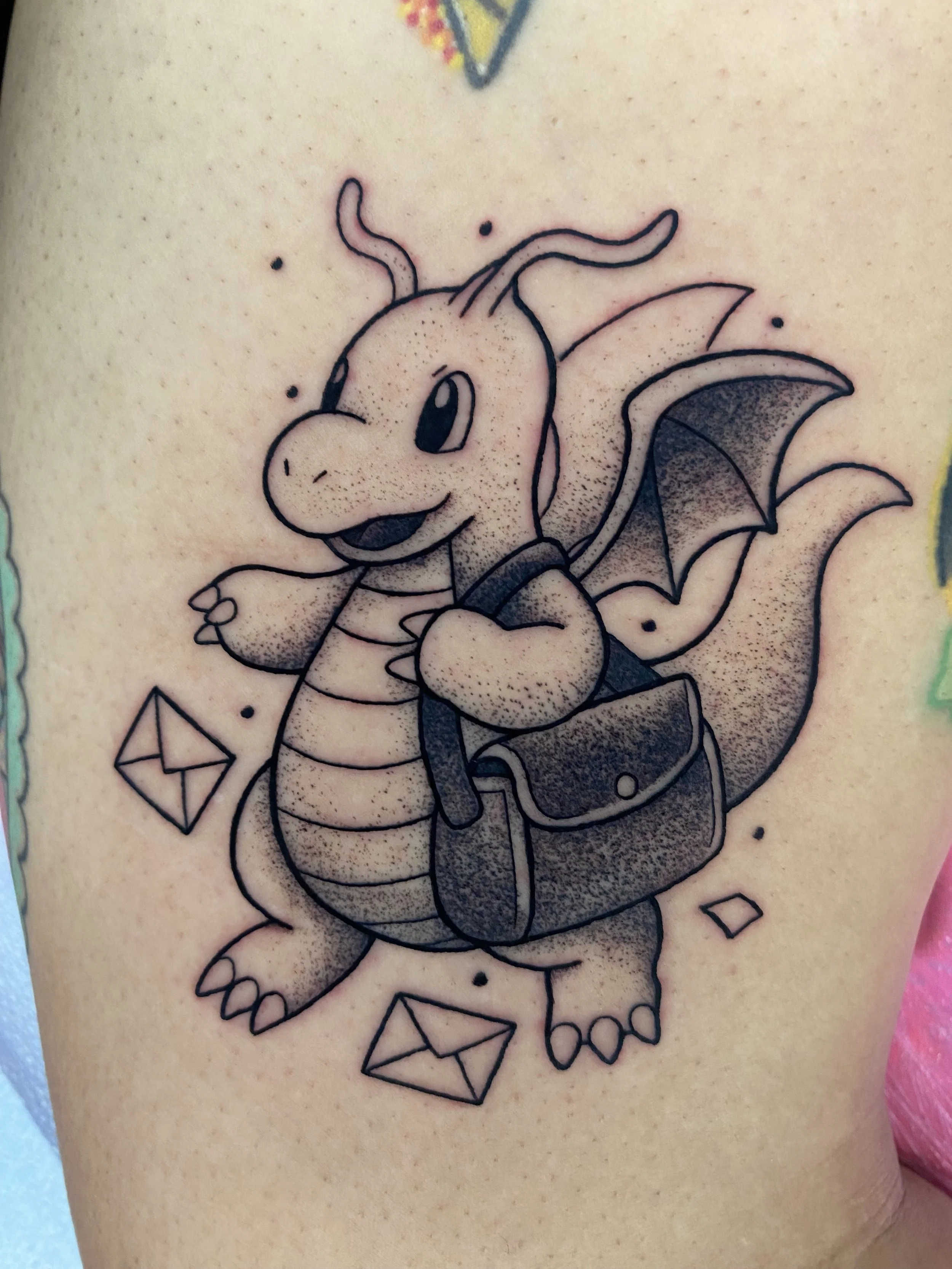 dragonite tattoo, pokemon tattoo, black and grey tattoo