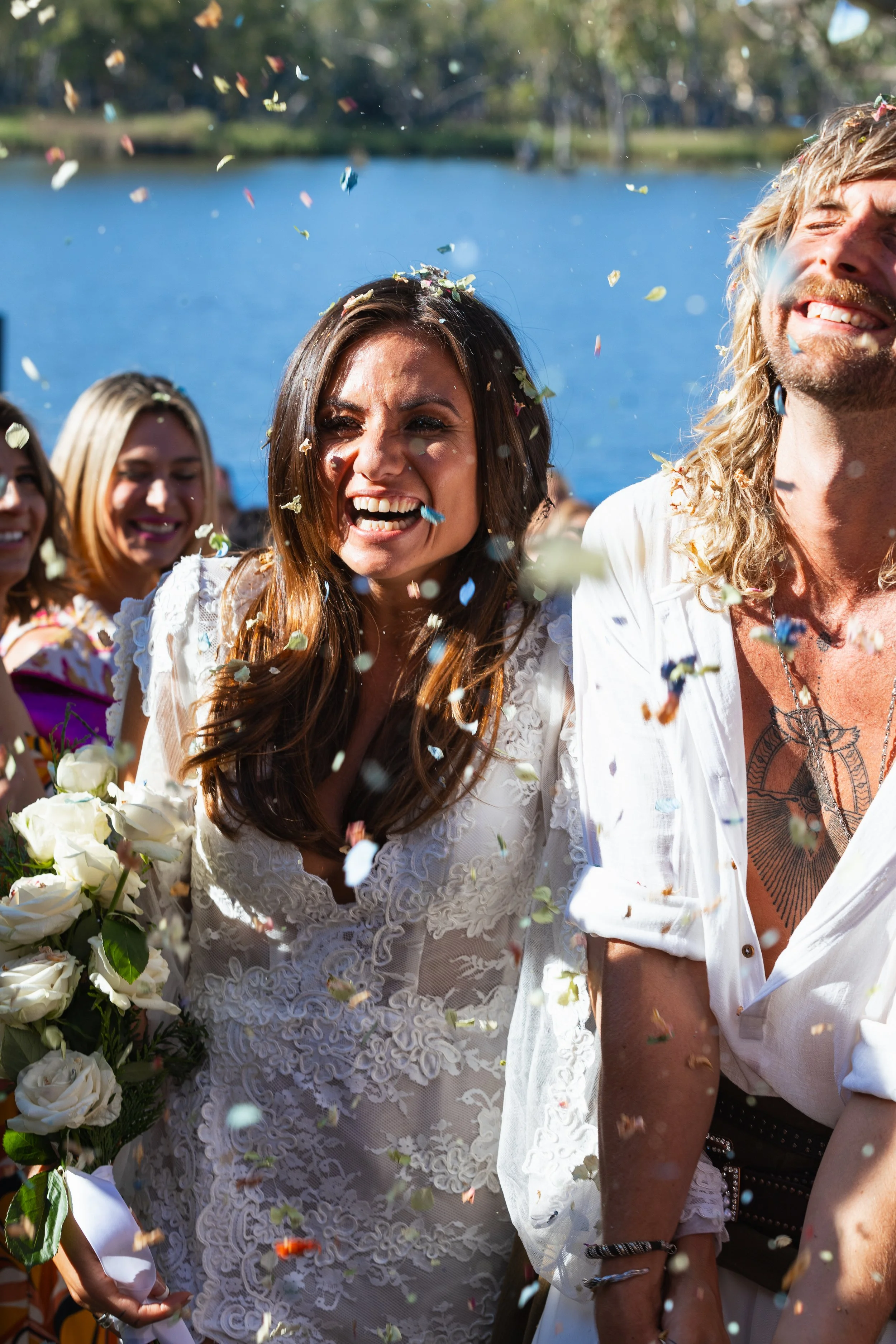 Bride walking down the aisle with her new husband, both with big smiles. Filmed by South Coast NSW videographer