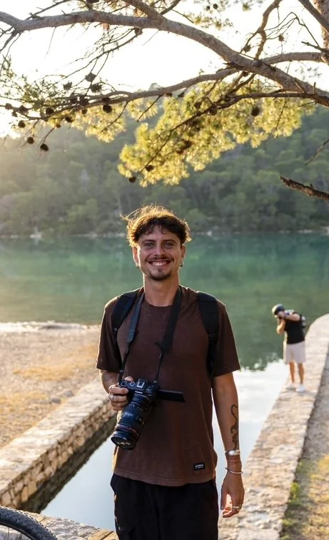 Wedding videographer filming a ceremony on the South Coast NSW coastline