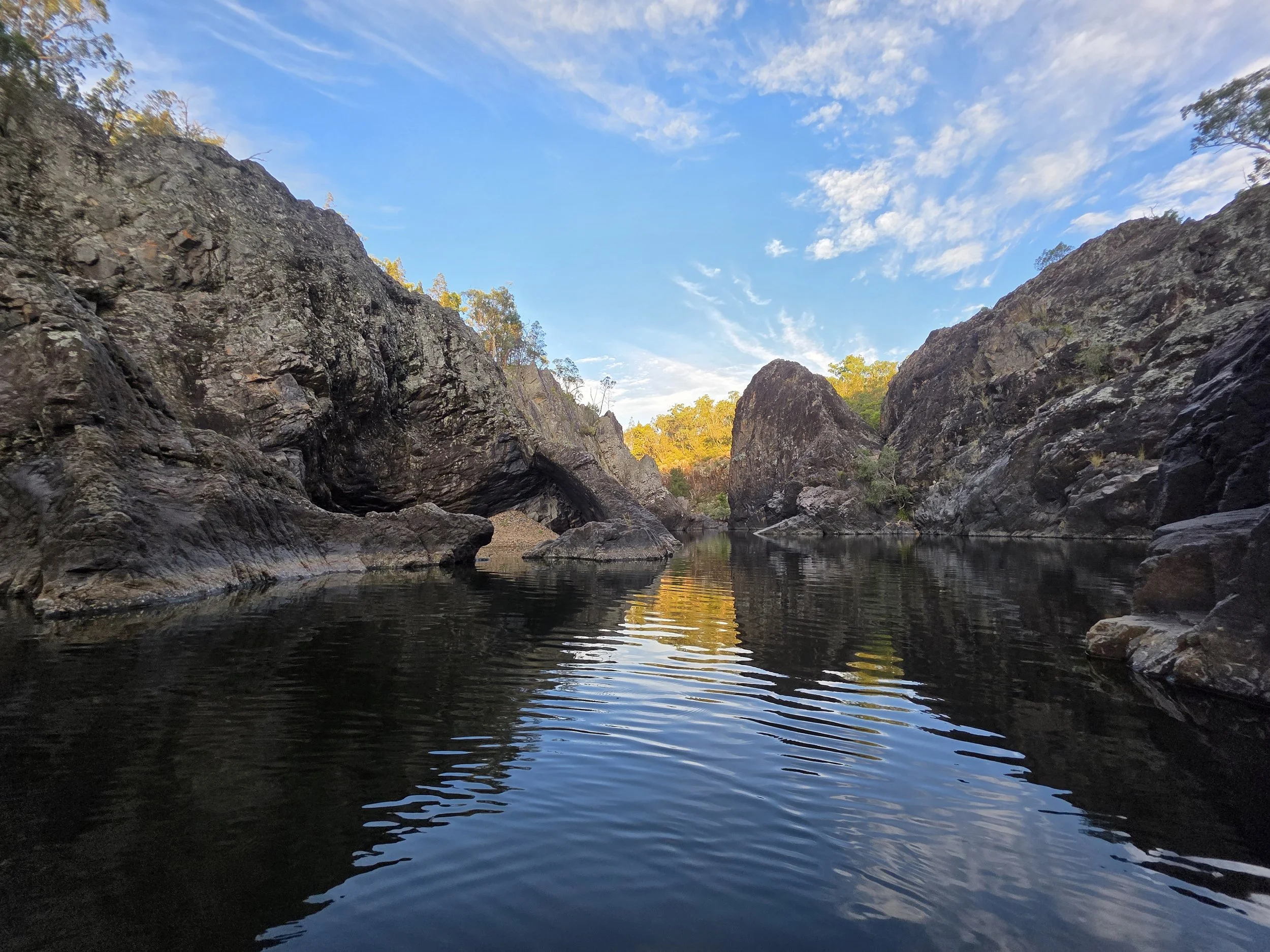 Pristine wilderness river gorge at Severn River Outpost, featuring rugged rock formations and clear blue skies.