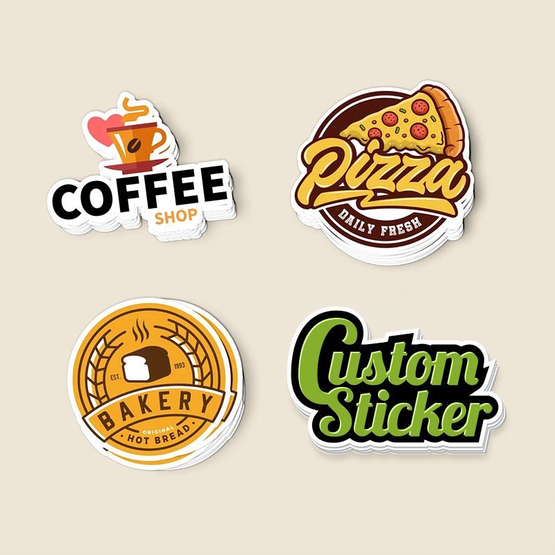 Four stickers featuring different food and shop themes: a coffee shop sticker with a steaming coffee cup, a pizza sticker with the text "Daily Fresh," a bakery sticker with a loaf of bread, and a customizable sticker with the text "Custom Sticker.".