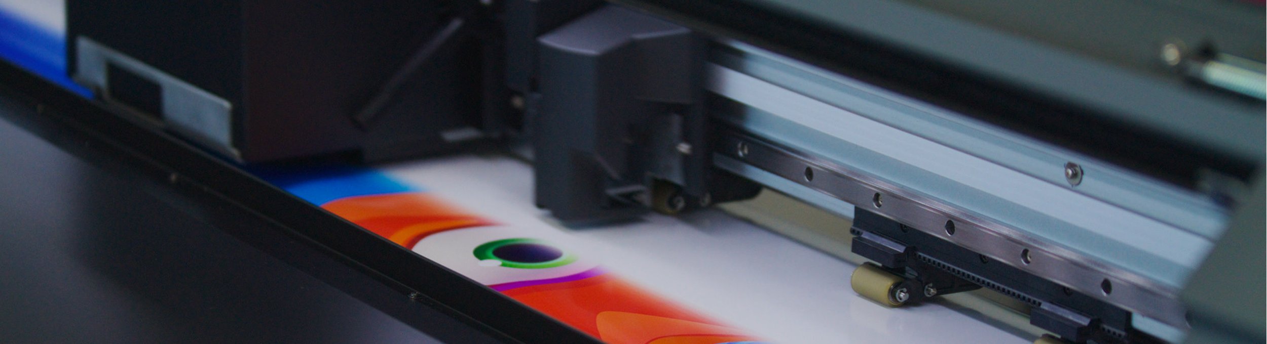 A printer printing a colorful design on paper.