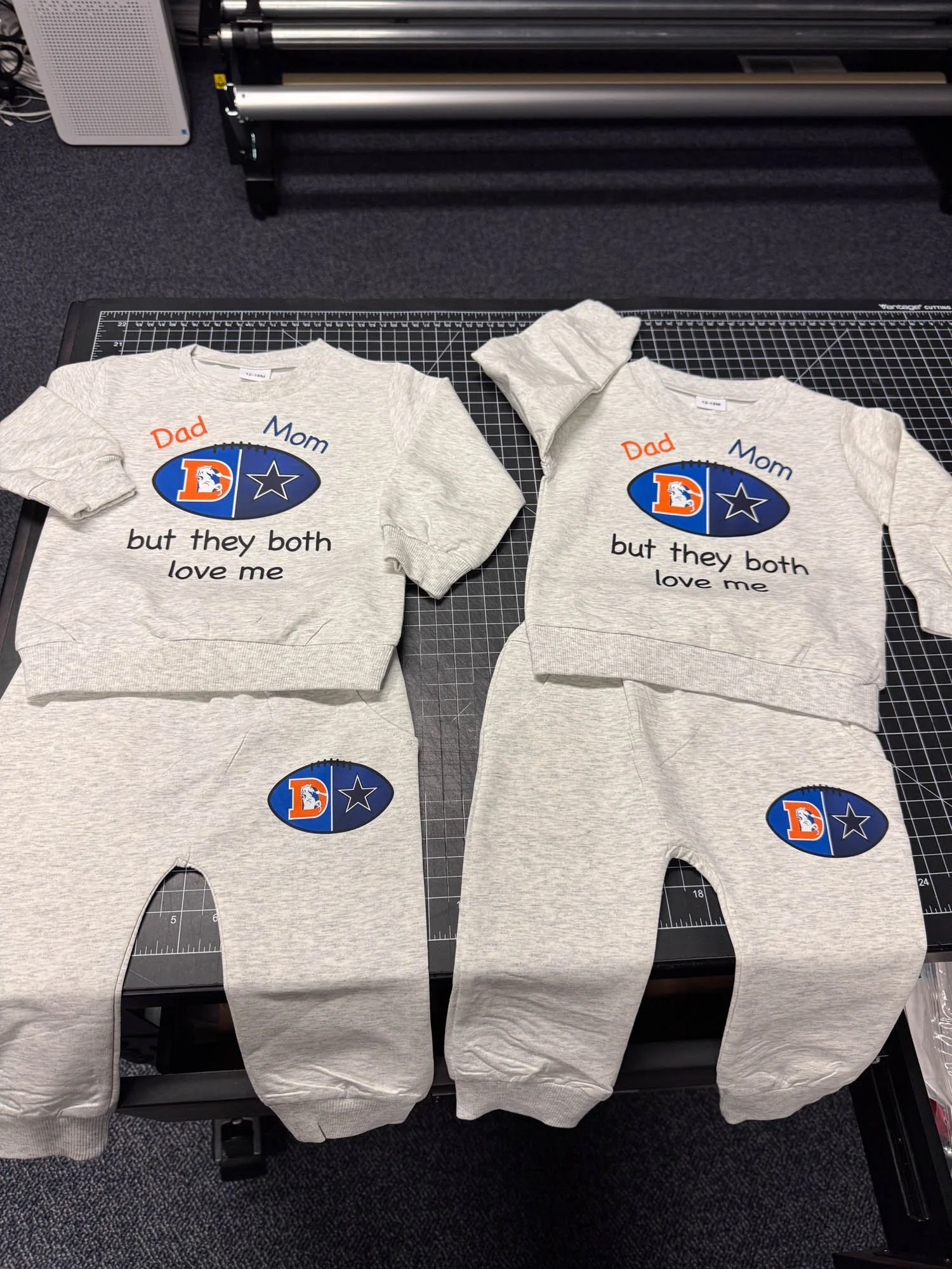 Matching gray sweatshirts and sweatpants for a family, featuring a Dallas Cowboys logo and the text 'Dad Mom but they both love me'.