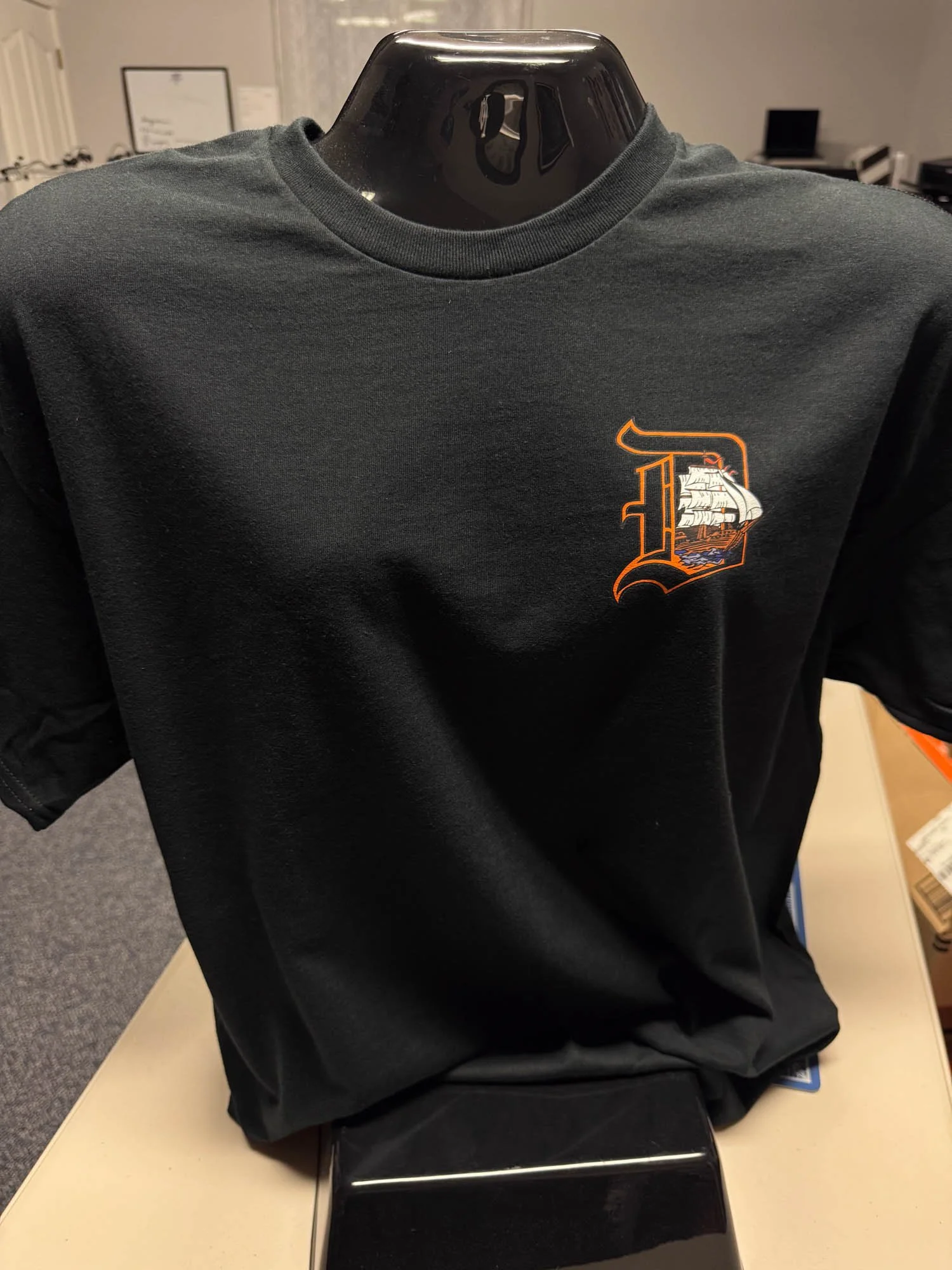 Black sweatshirt with Detroit Tigers logo featuring a sailing ship on the front.