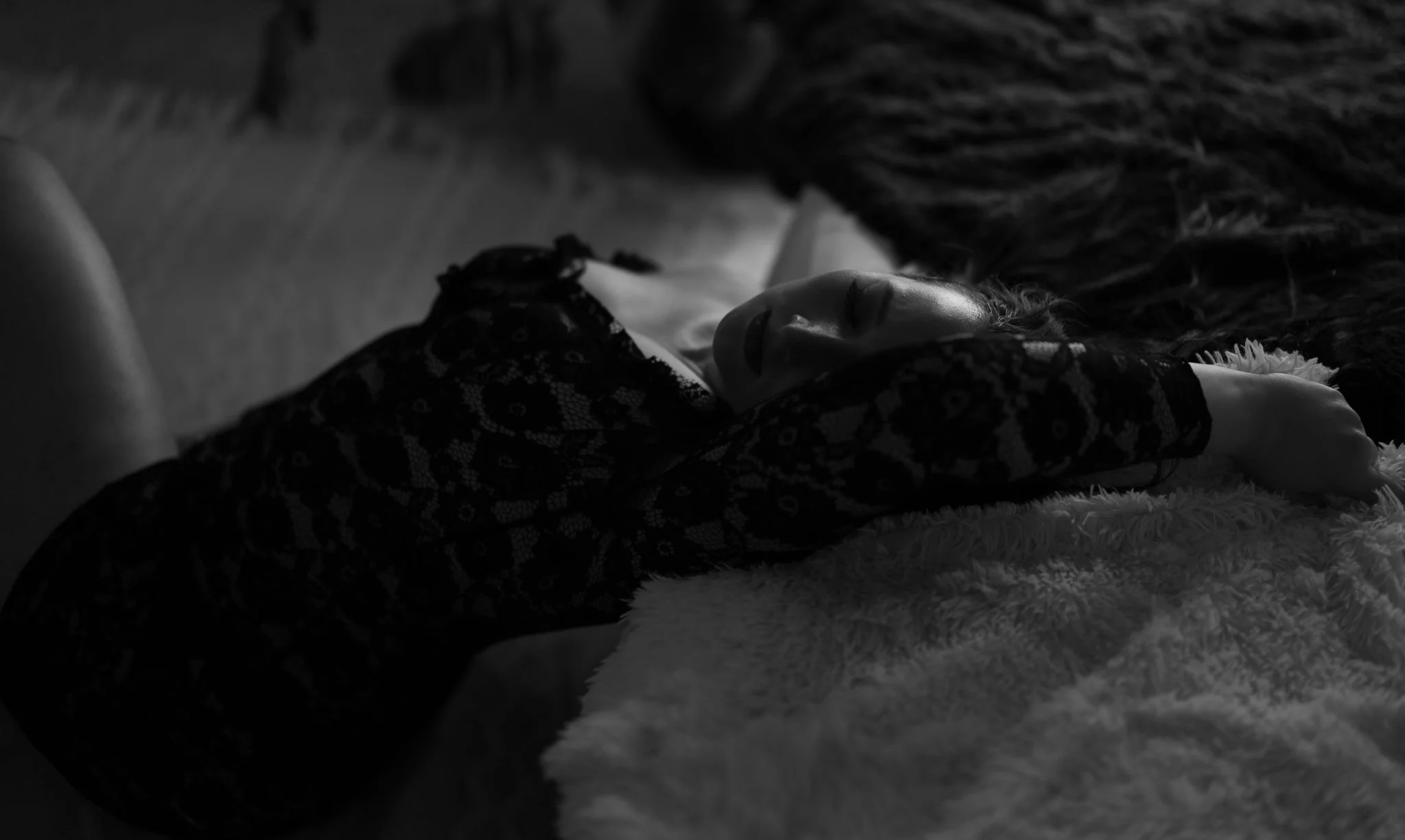 Moody, black and white artistic boudoir photography highlighting the journey from vulnerability to self-worth in our Gulf Breeze studio.
