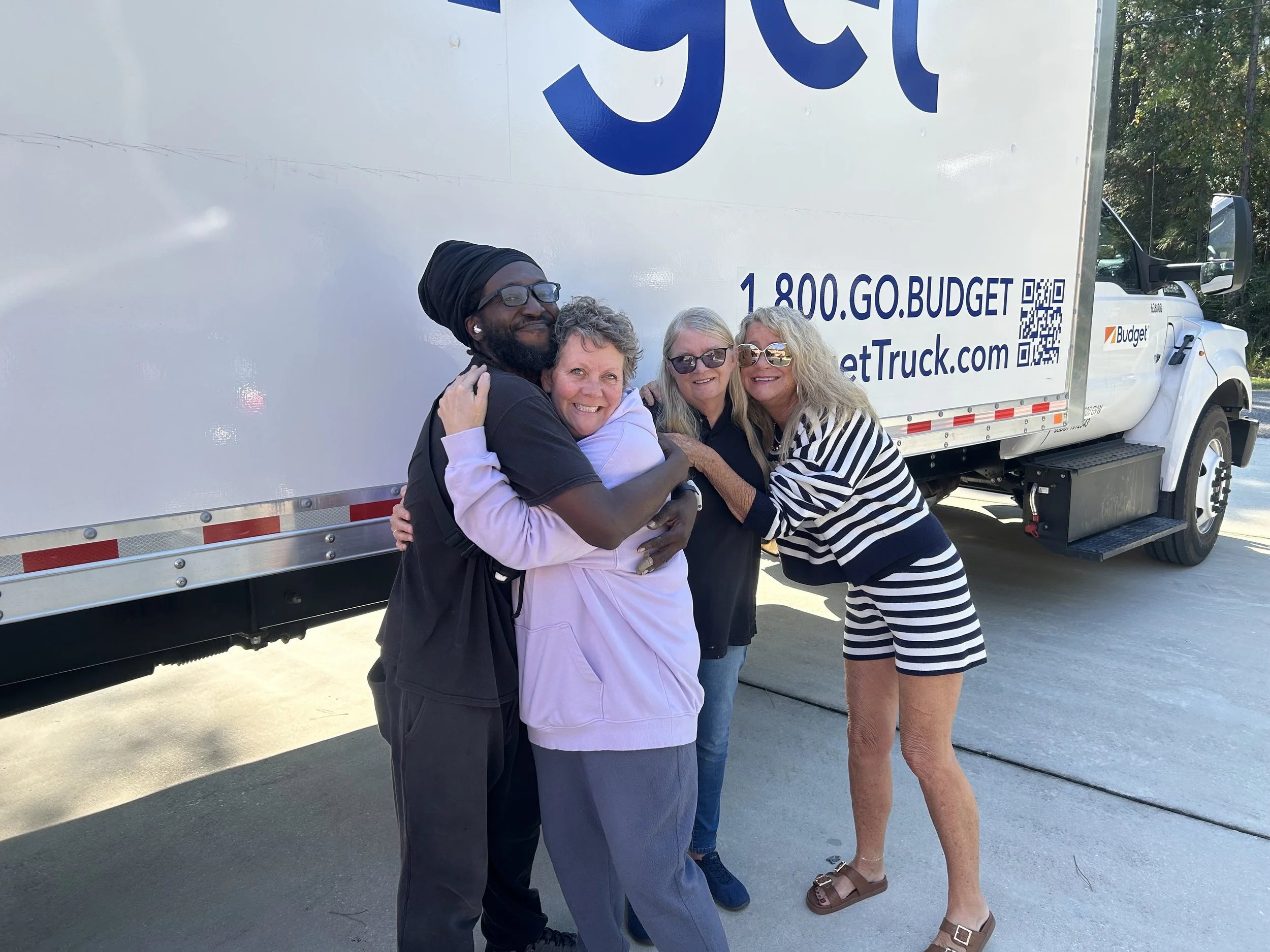 The emotional connection visible in this delivery completion embrace reflects the trust and appreciation that results when moving professionals treat customers' possessions and concerns with genuine care rather than viewing relocations as purely tran