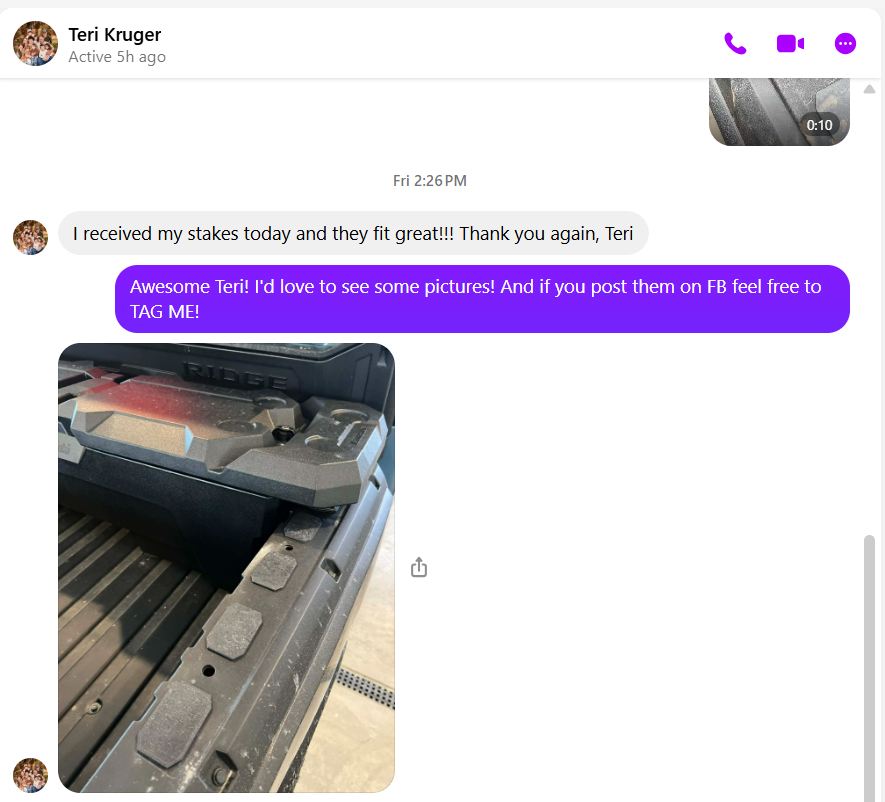 Close-up of a riding lawnmower or tractor, showing its mowing deck with blades and wheels.