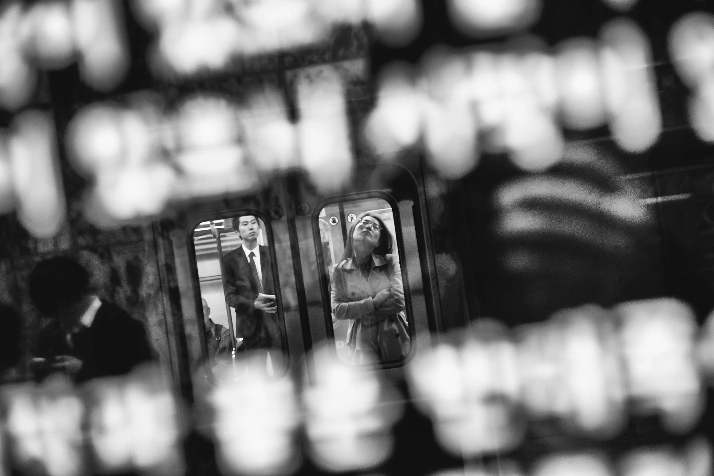 black and white photo inside a bus terminal station in Seoul, South Korea