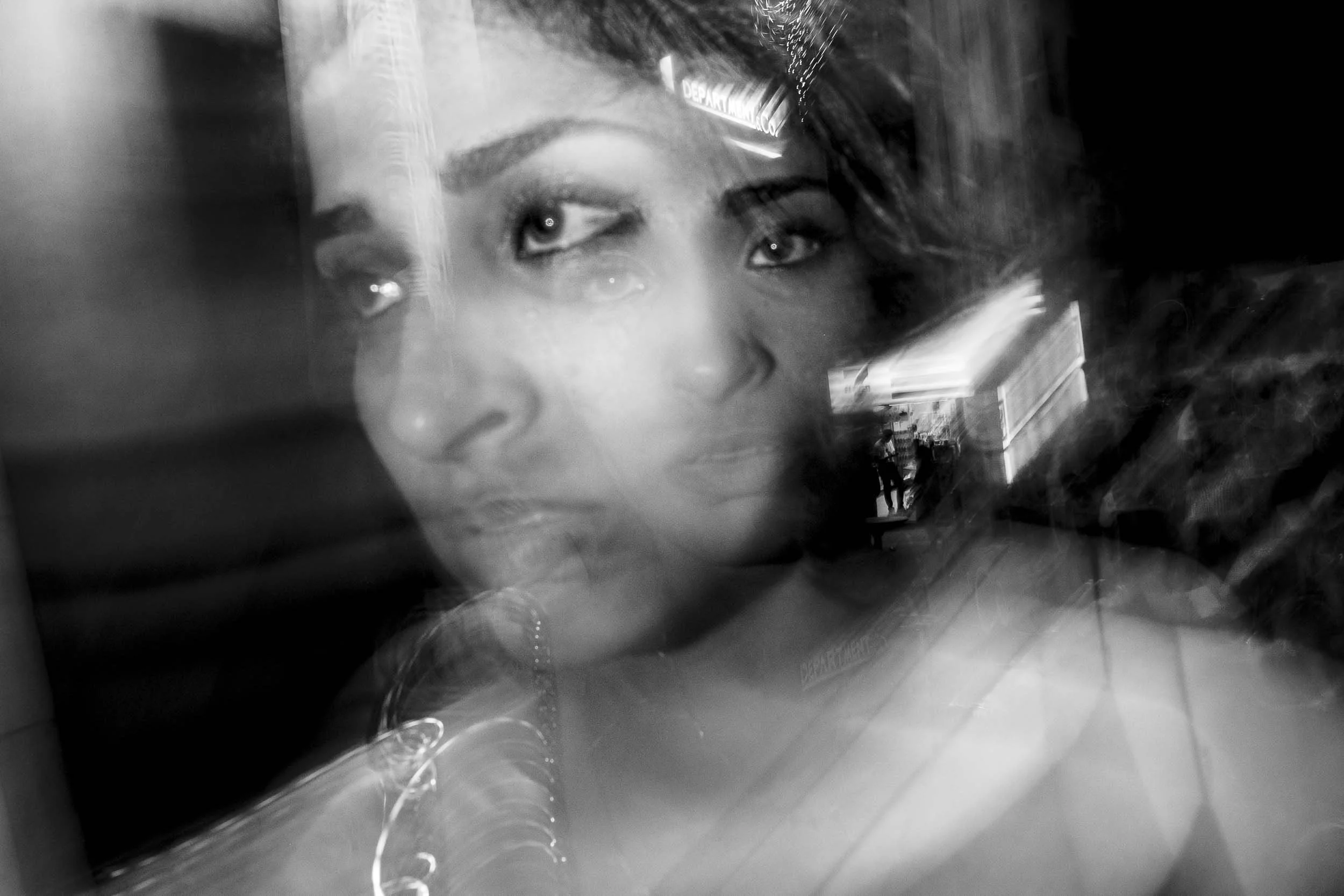 black and white double exposure portrait of a woman.