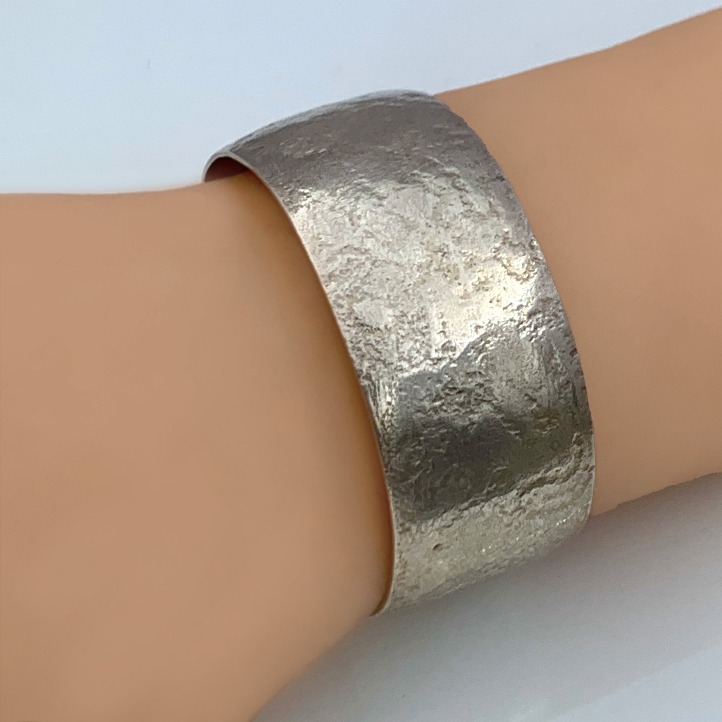 Handcrafted textured sterling silver cuff bracelet with textured surface